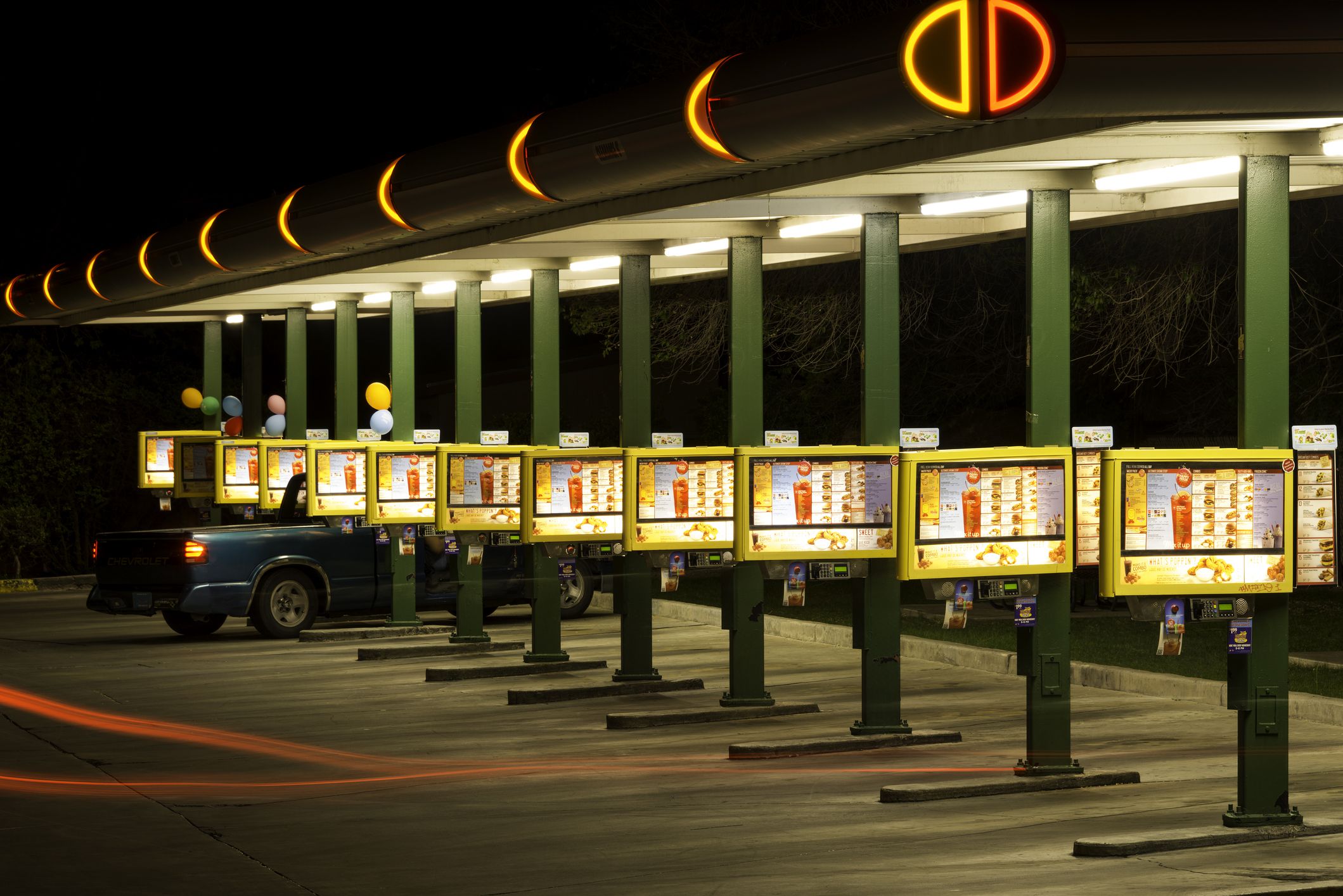Sonic Drive-In Restaurant on Route 66 at night.