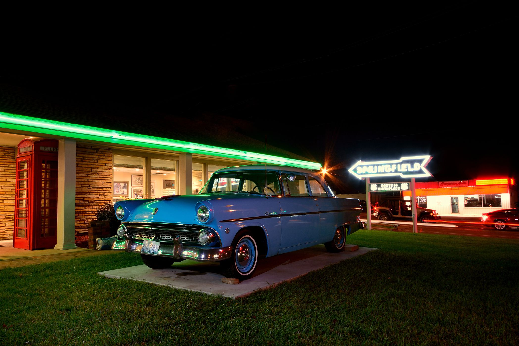 springfield neon sign and classic car