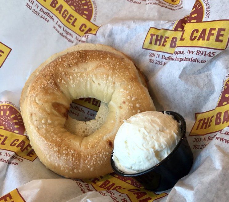 The Bagel Cafe bagel and cream cheese in paper