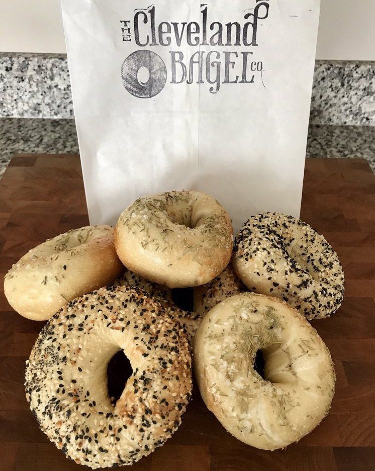 The Cleveland Bagel Co. paper bag and different bagels in front
