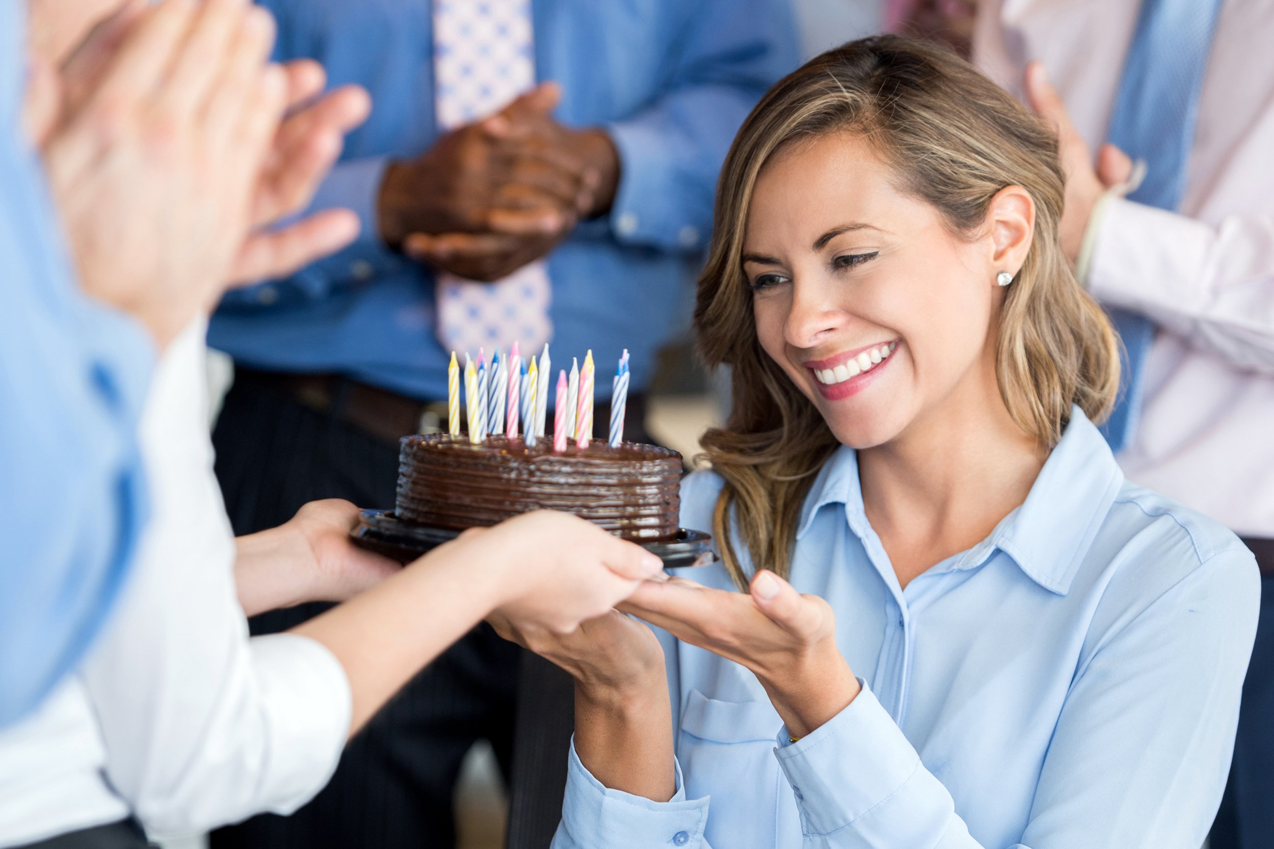Woman celebrating birthday in office