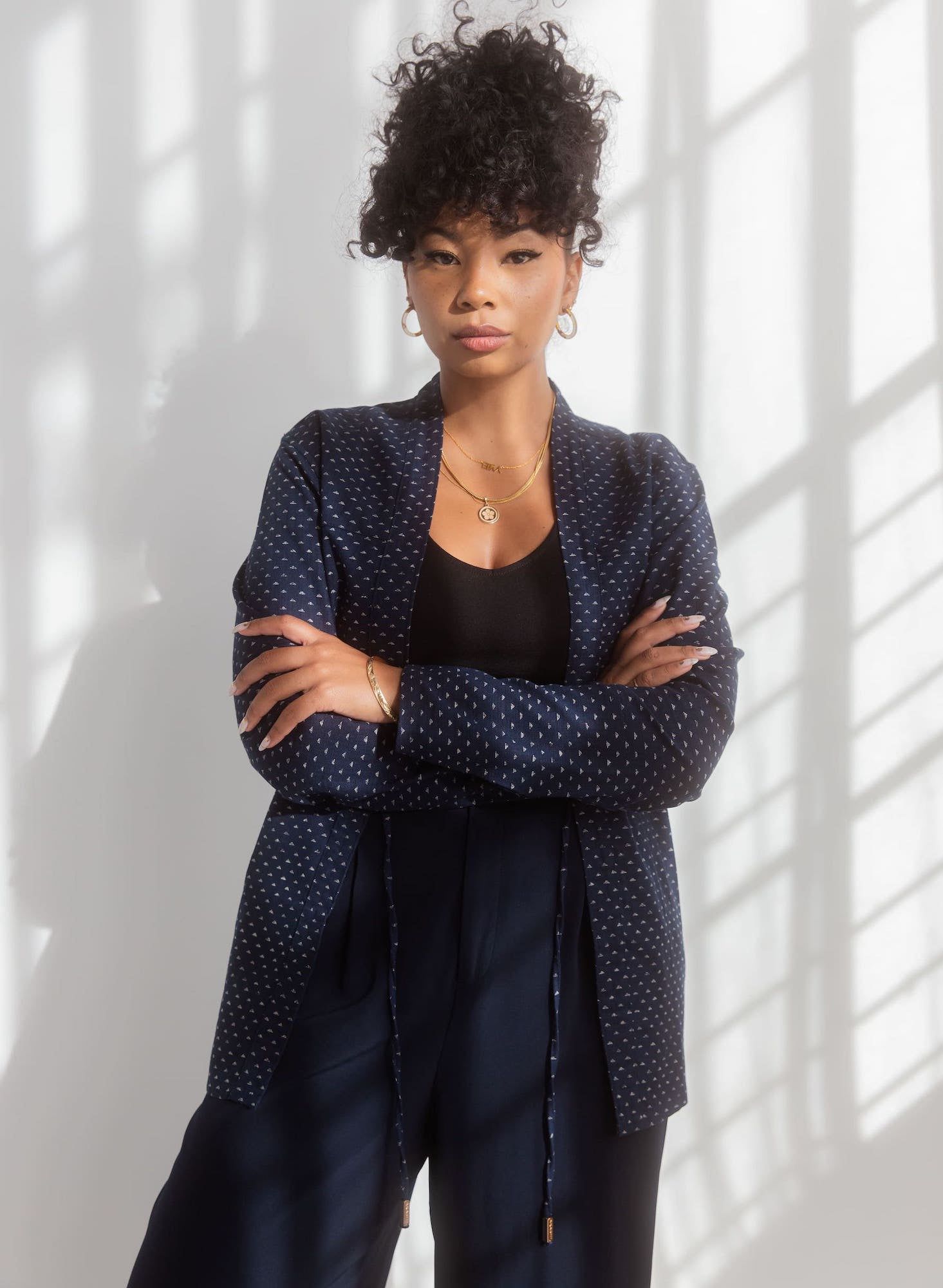 Young woman posing in a navy with white polka dots Noragi Jacket, Akashi-Kama