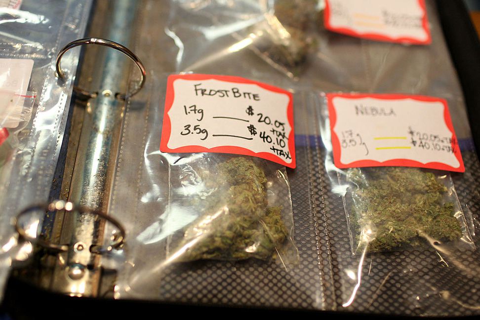 different strains of medical marijuana with prices listed + tax are displayed in a three ring binder at coffeeshop blue sky cannabis dispensary july 22, 2009 in oakland, california