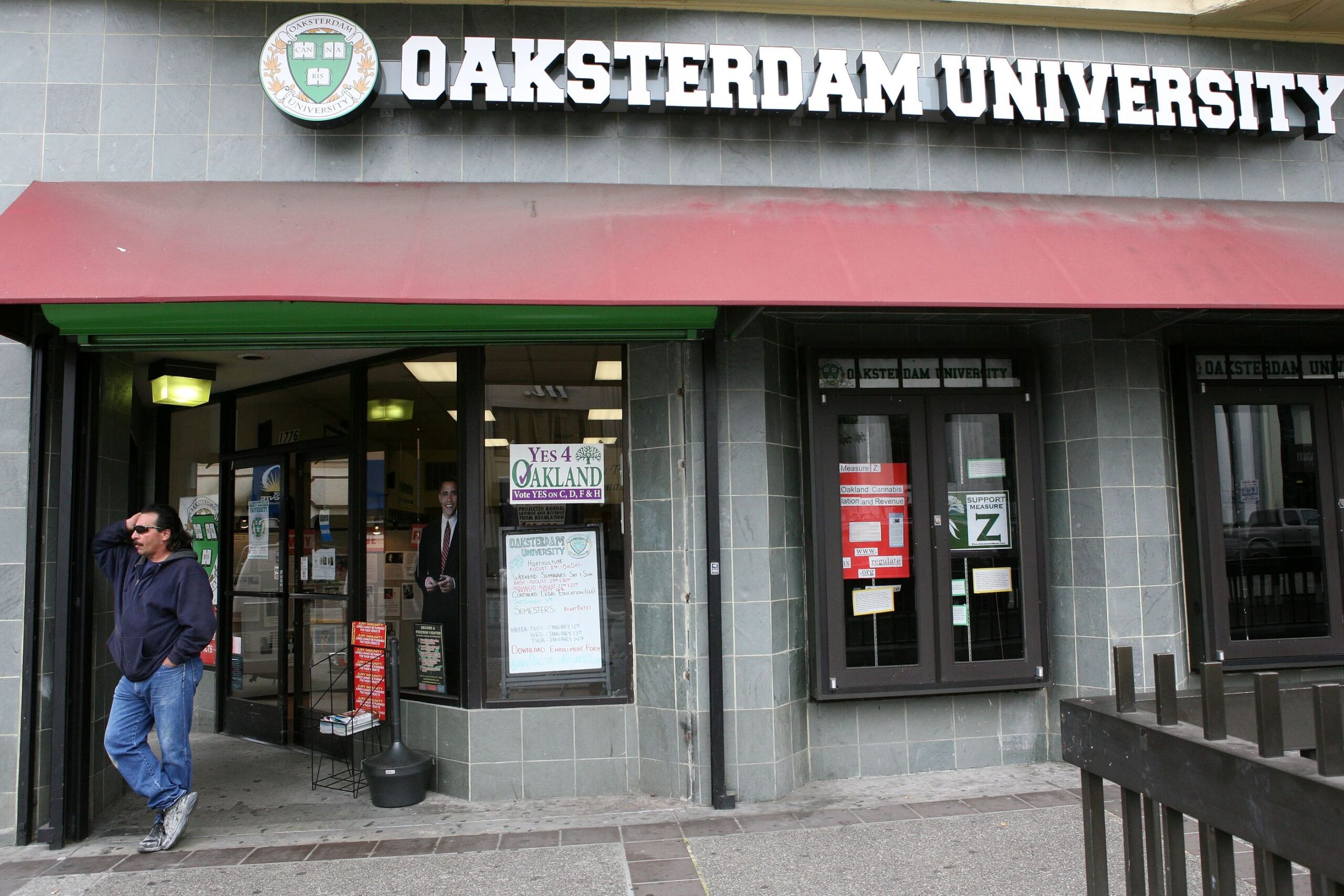 a man waits for a bus in front of oaksterdam university july 22, 2009 in oakland, california