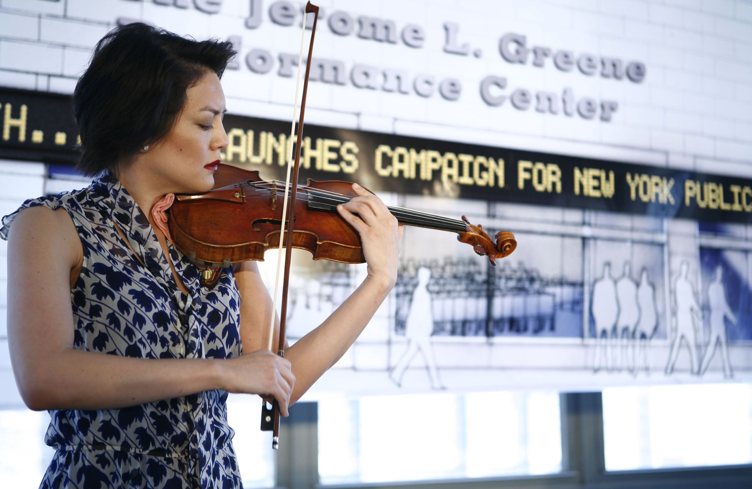 Woman playing the Vieuxtemps Guarneri Del Gesu Violin
