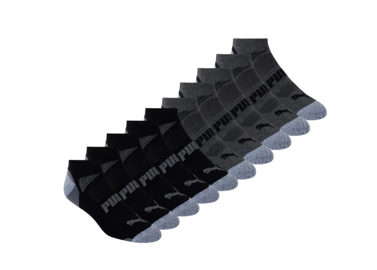 A set of ten pairs of ankle socks in black and gray, arranged in two rows. Featuring the "Puma" name and logo on top, these are among the best Costco finds for everyday comfort and style.