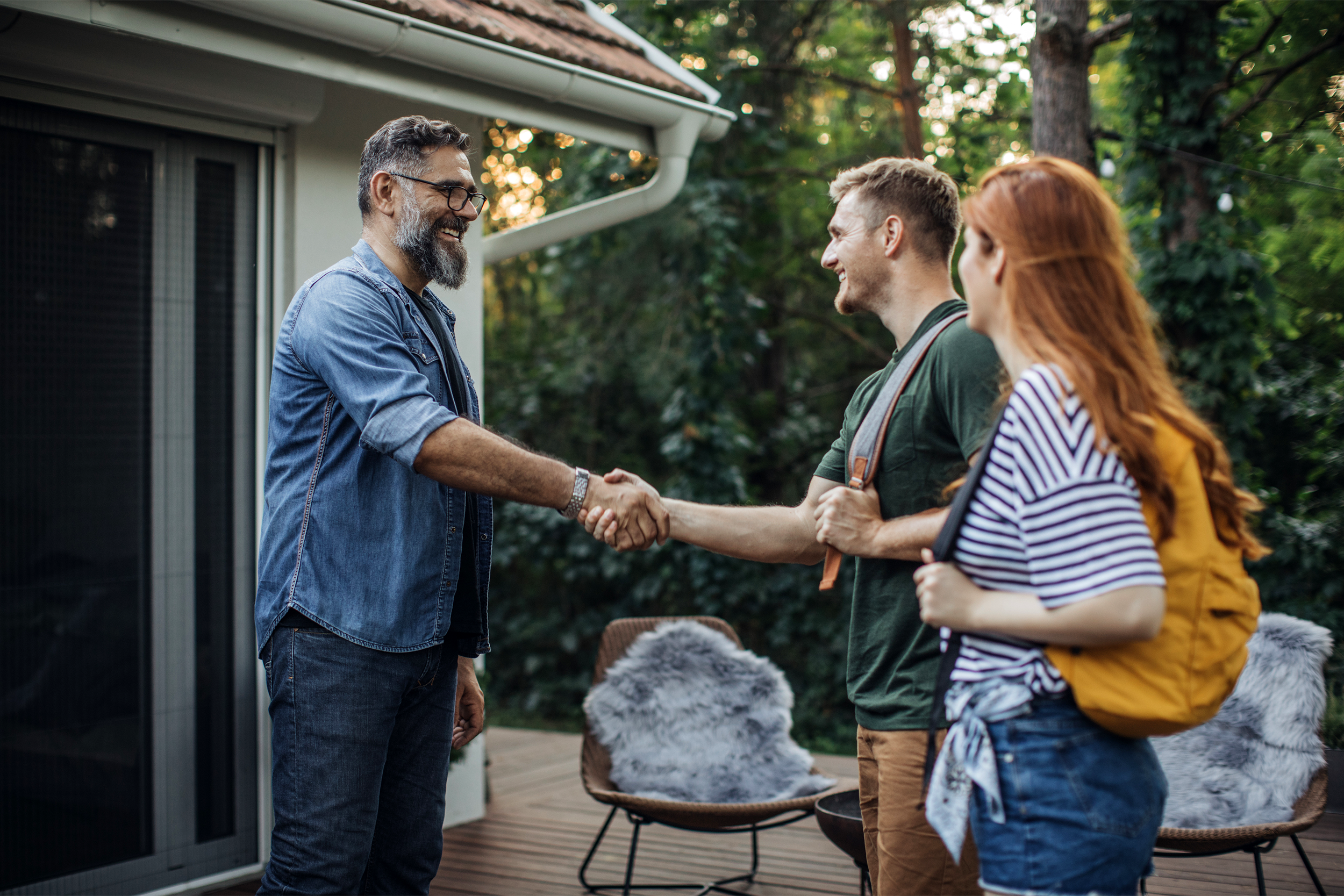 Older man renting house to younger couple