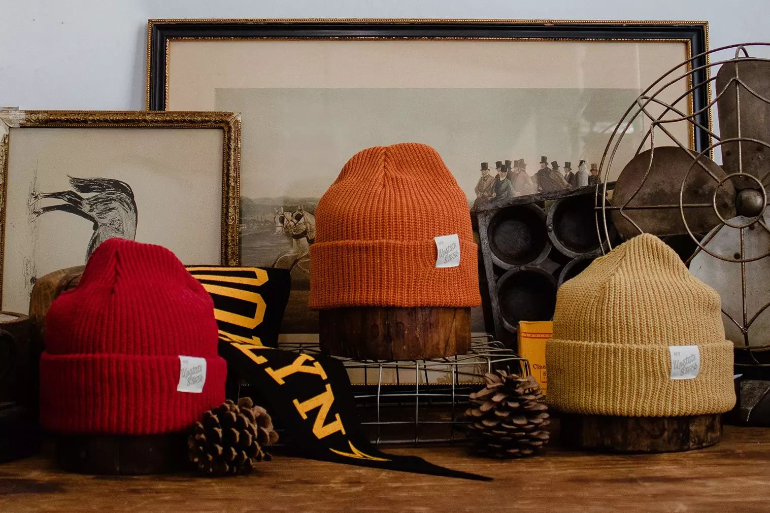 Red, orange and beige knit hats by Upstate Stock among neutral vintage decor.