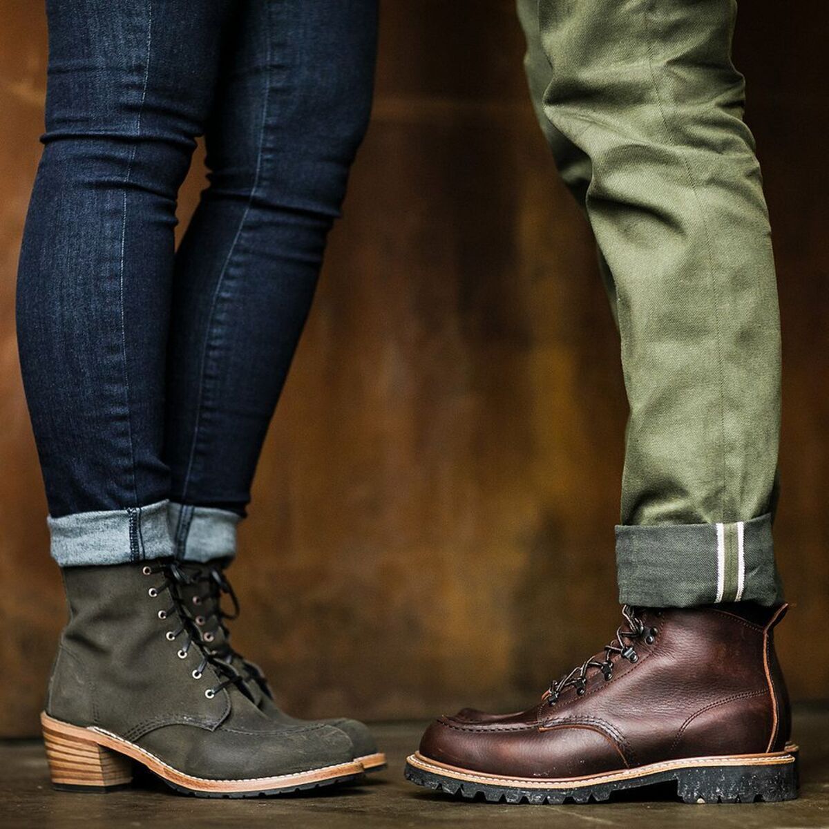 Woman on left and man on right both wearing Red Wing Shoes boots with the focus on legs in jeans and feet