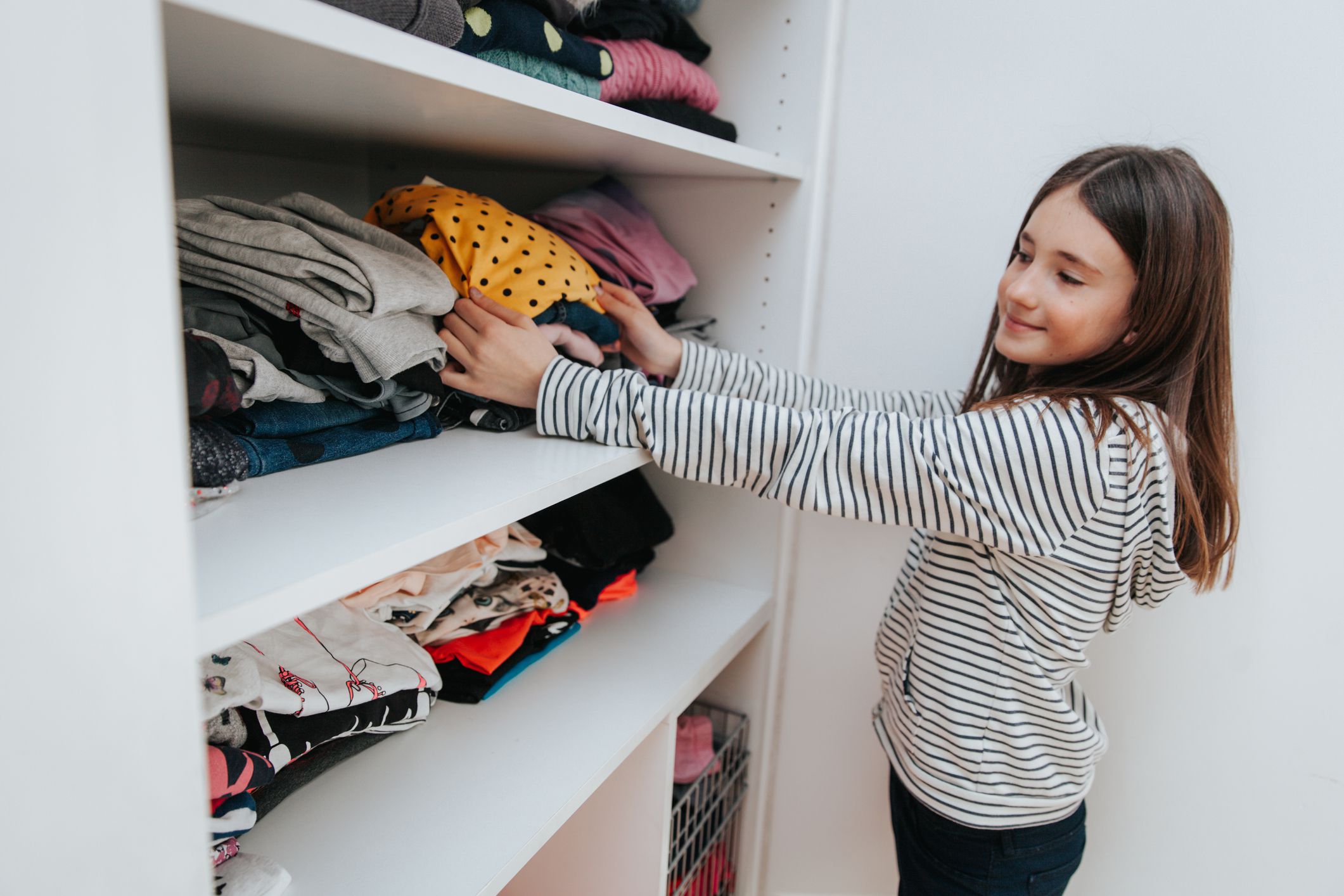 girl picking an outfit to wear