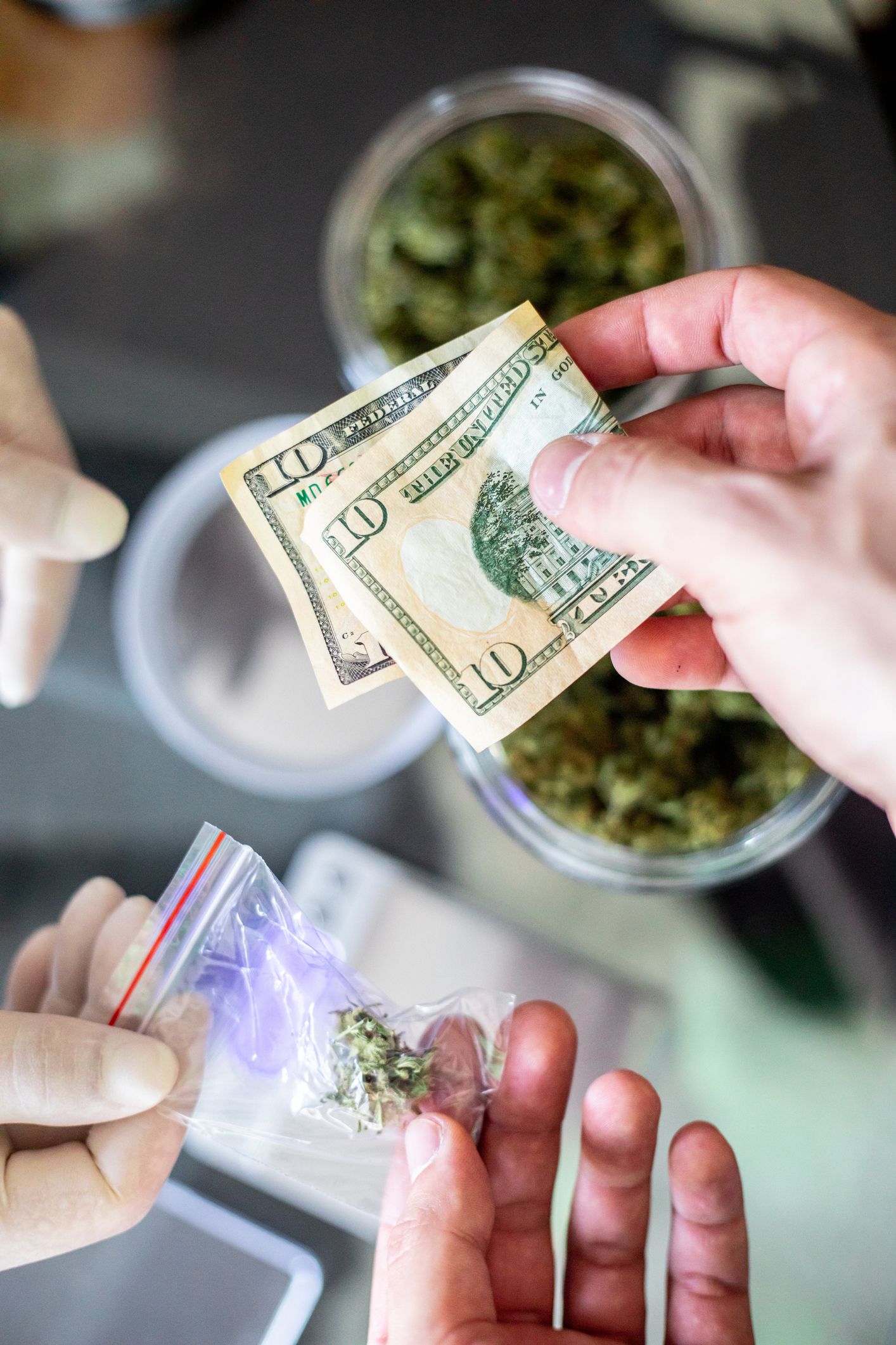 customer paying at dispensary in cash