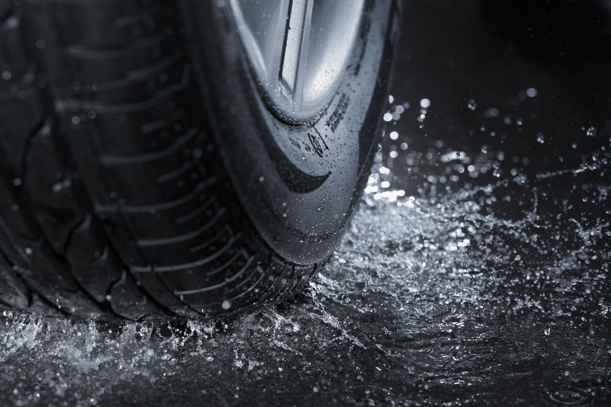 Car tire splashing in water