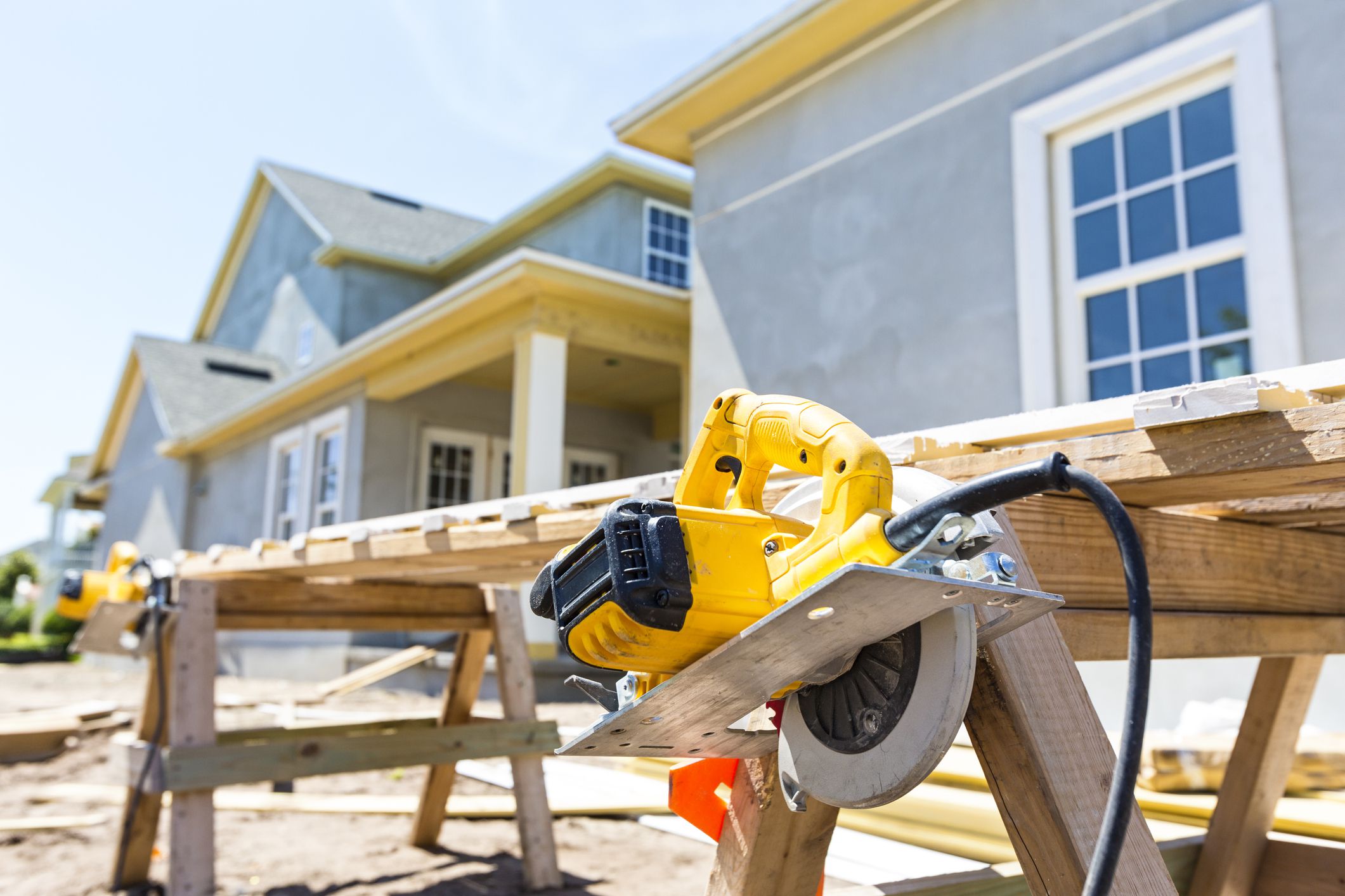 Tools are displayed at their work stations around the construction site of a new home.