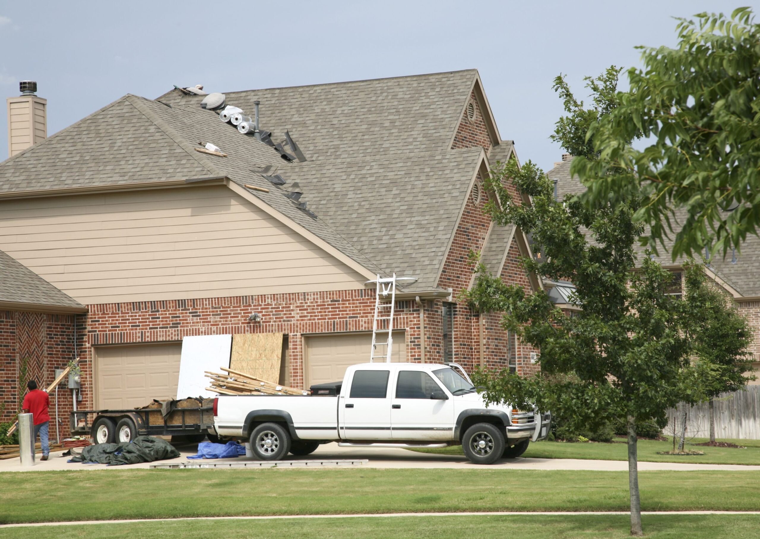 Workers Working on A House Roof.