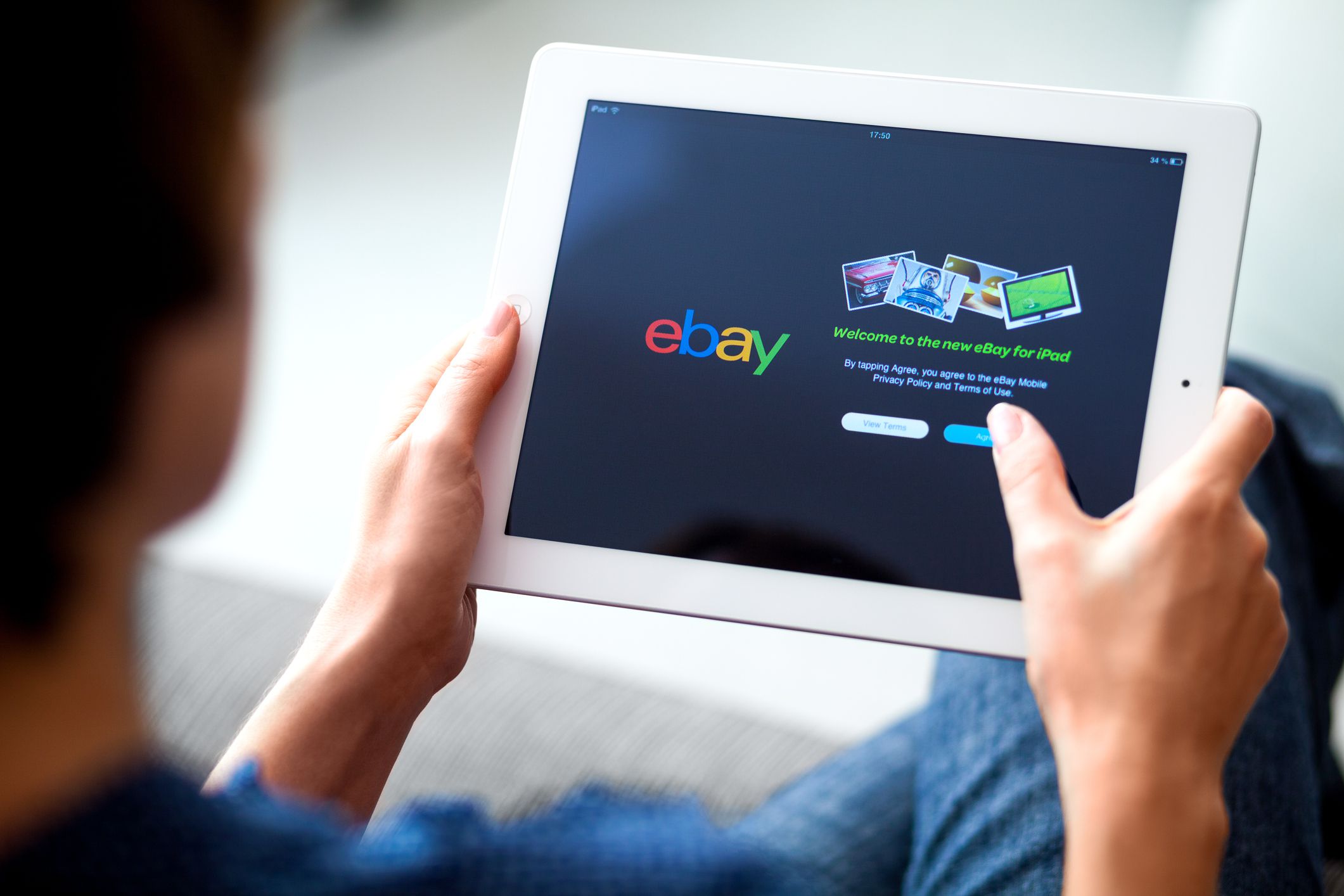 Woman hands holding on iPad with Ebay app