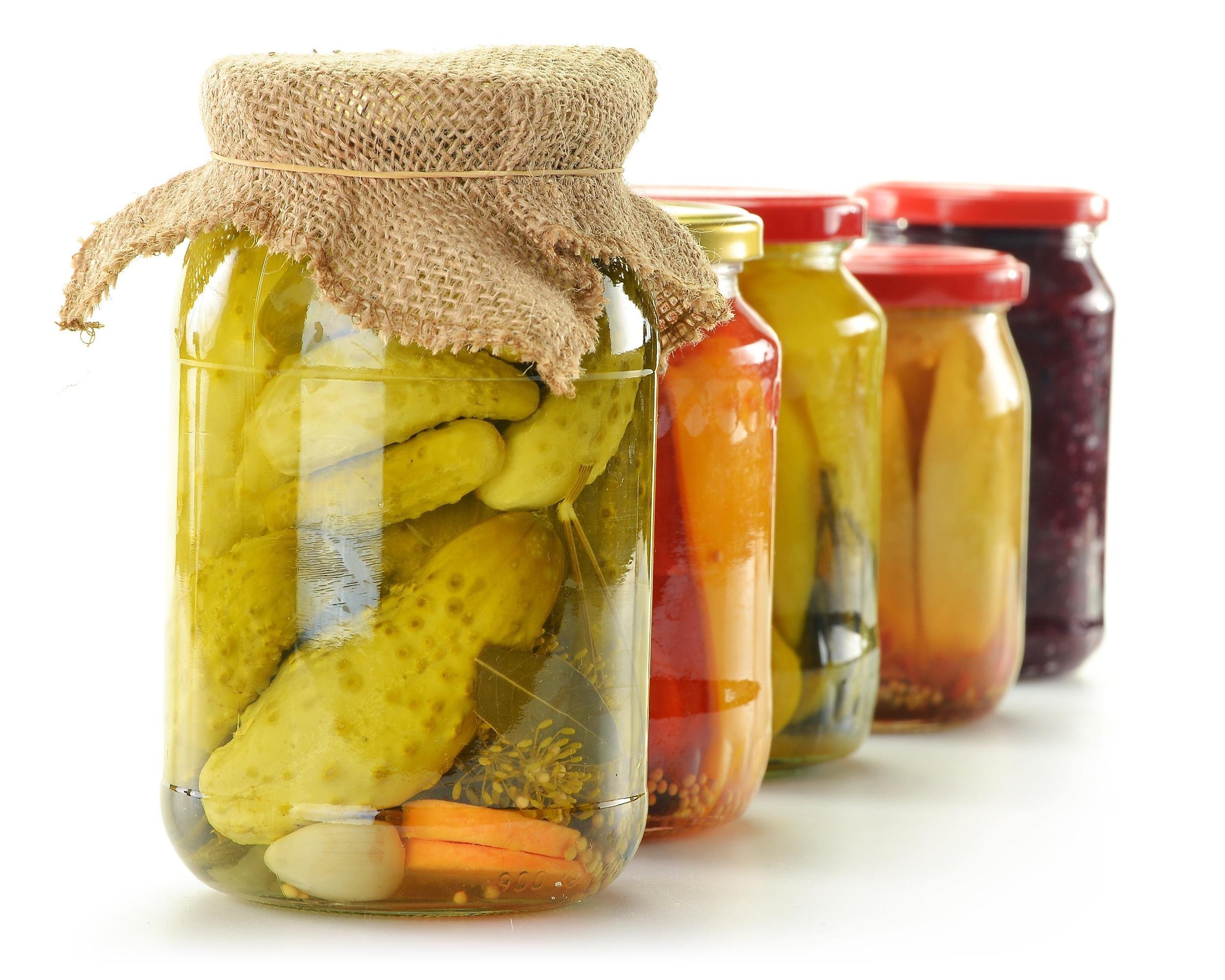 five jars of pickled vegetables