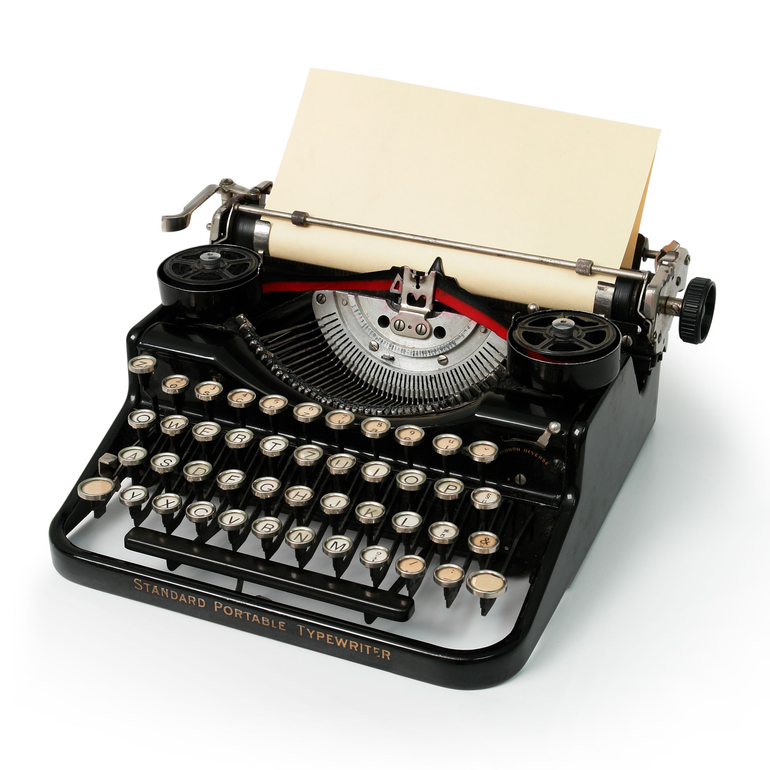 Black vintage portable typewriter with a piece of plain white paper on a white background