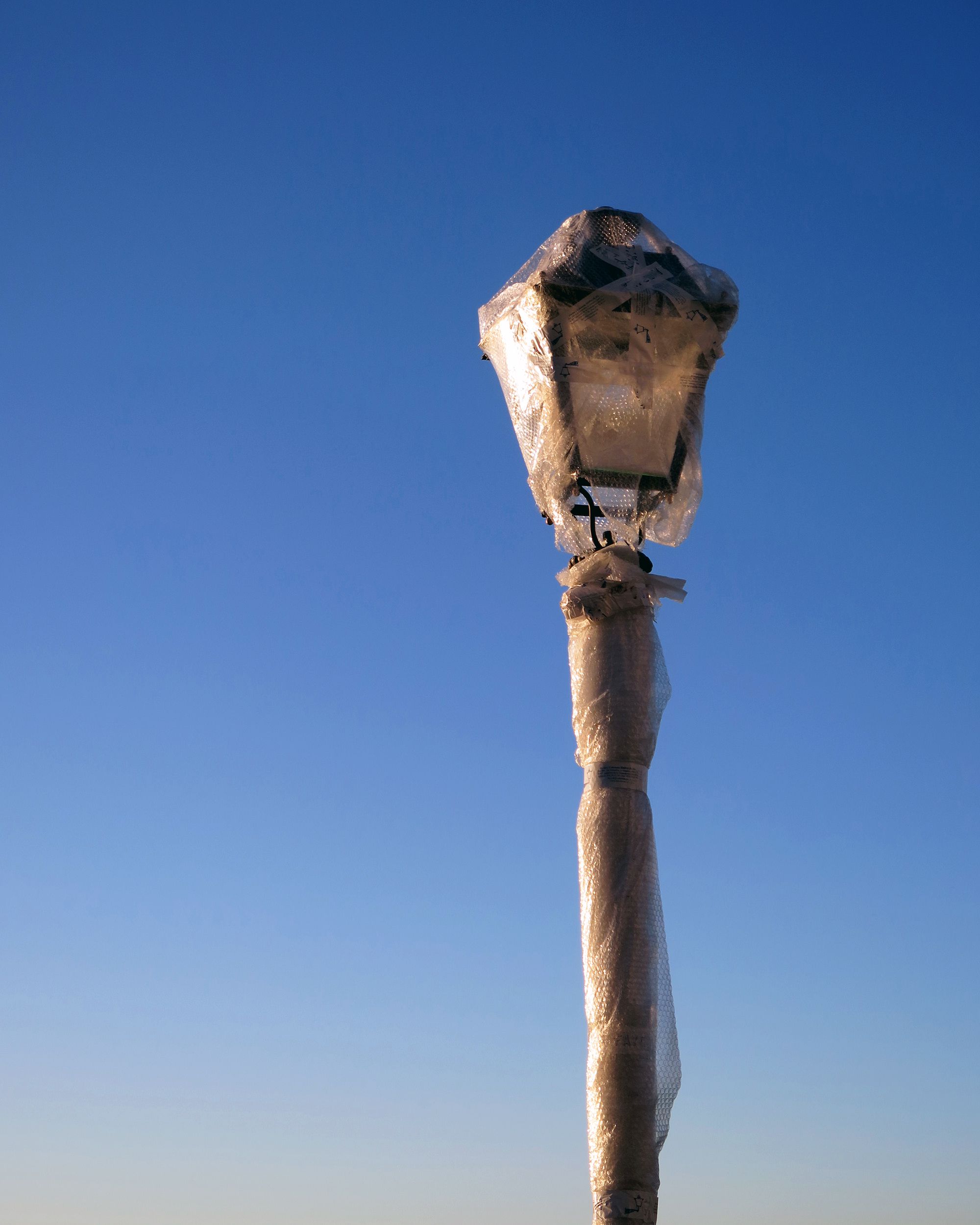 Street light covered in bubble wrap
