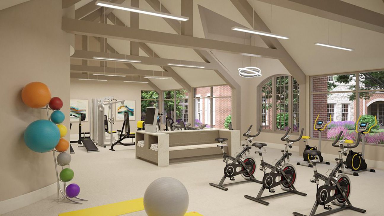 First Community Village fitness area with stationary bikes and big rubber balls