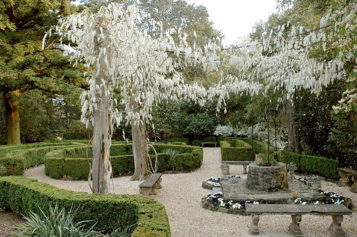 Hills & Dales Estate Garden, LaGrange, Georgia, trees with white flowers and manicured bushes with seating areas
