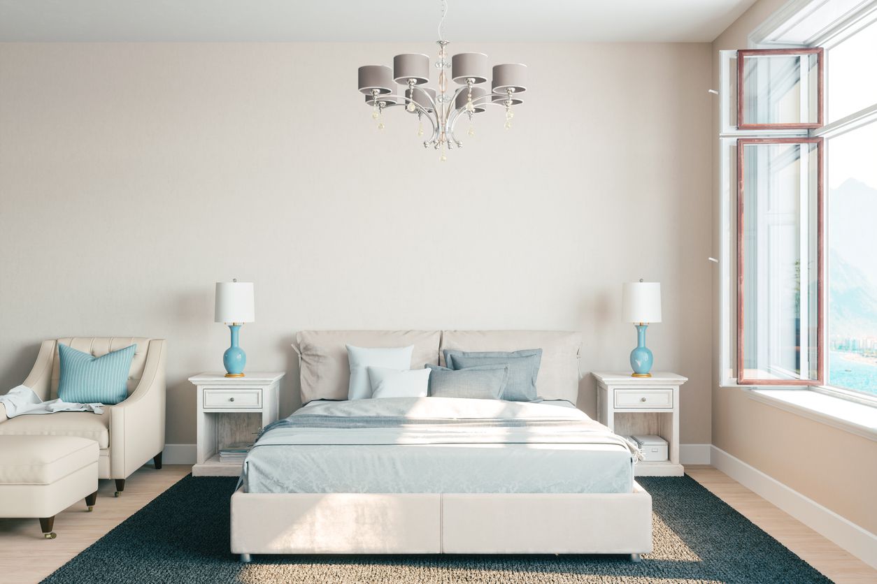 Luxury beige bedroom with a large open window