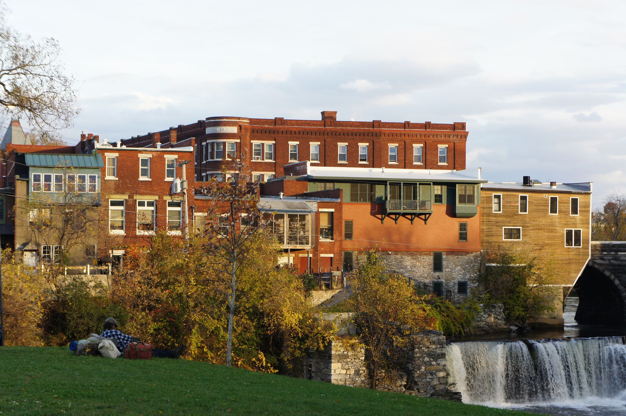 Middlebury Waterworks, Middlebury, Vermont, during sunset, waterfall to the right, late autumn