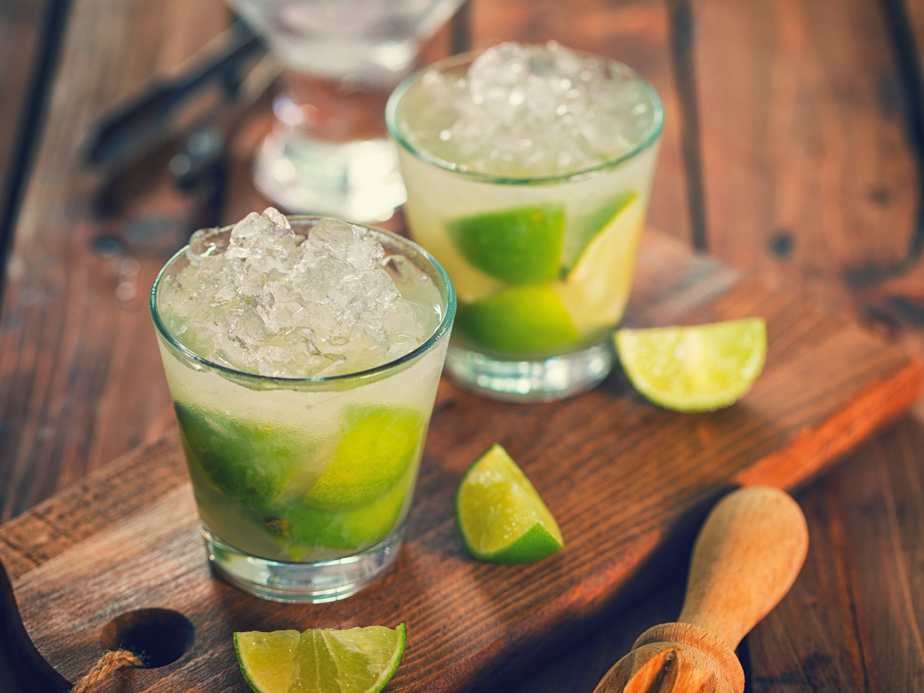 Sweet and refreshing Caipirinha national cocktail from Brazil made with lime, ice, sugar, and a sugarcane liquor
