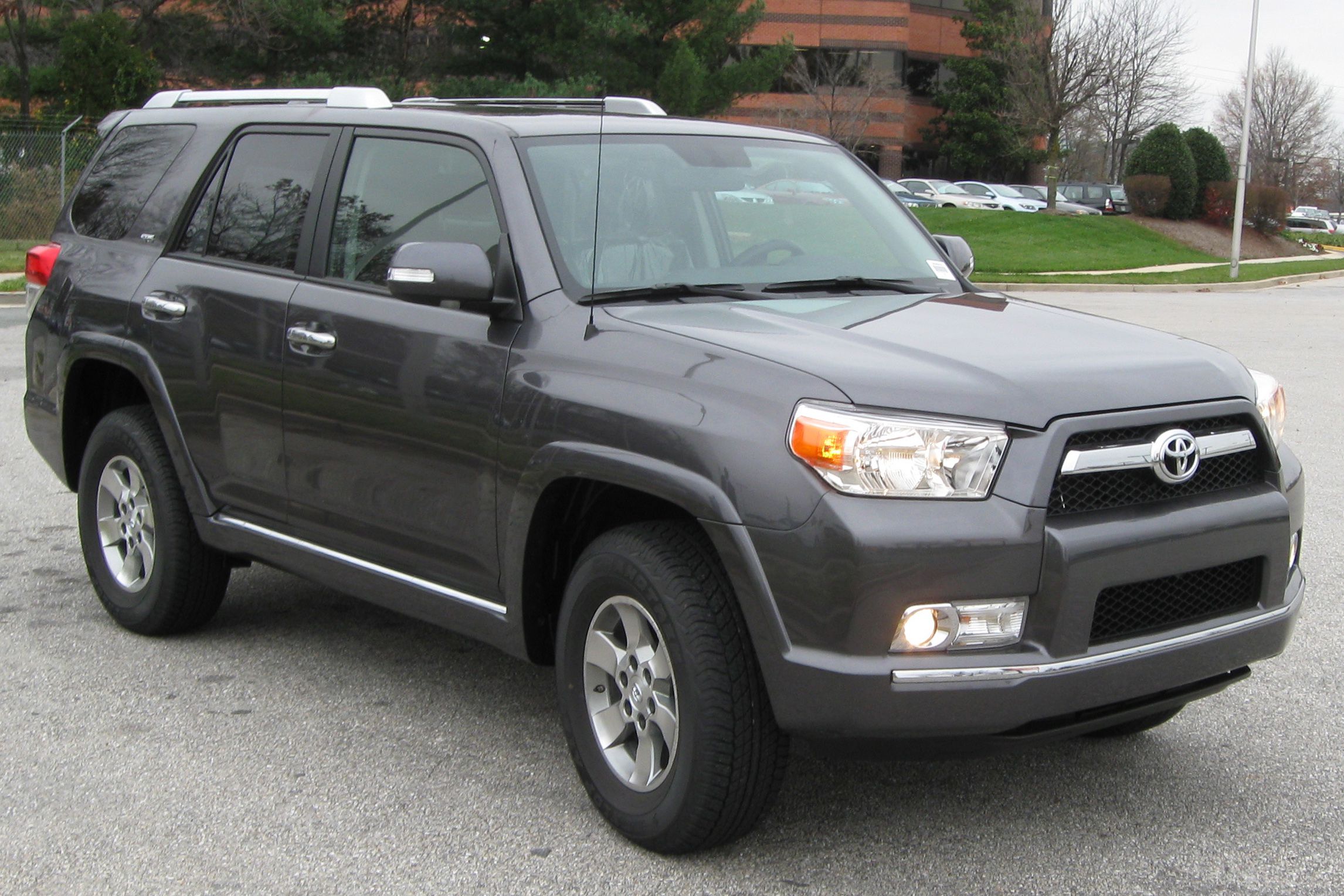 Gray Toyota 4Runner parked on street on cloudy day