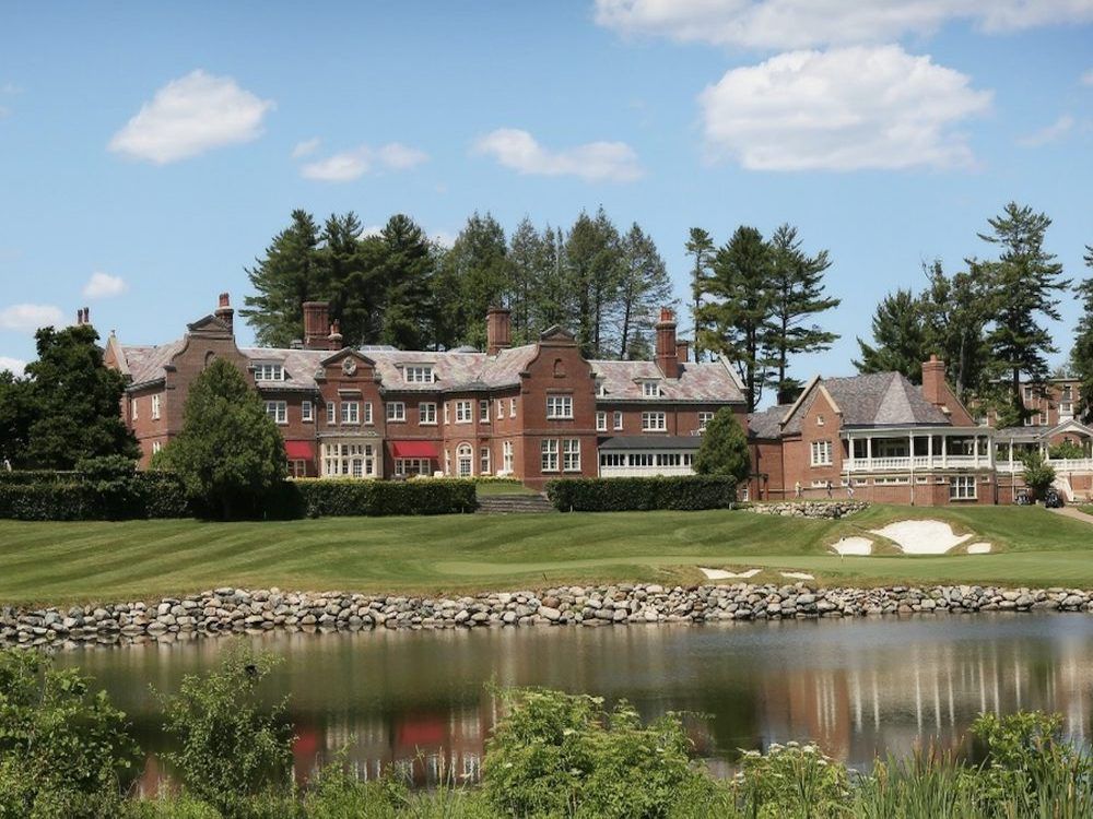 Residence at Turner Hill, Ipswich in Massachusetts, a huge beautiful manor made of brick with a pond