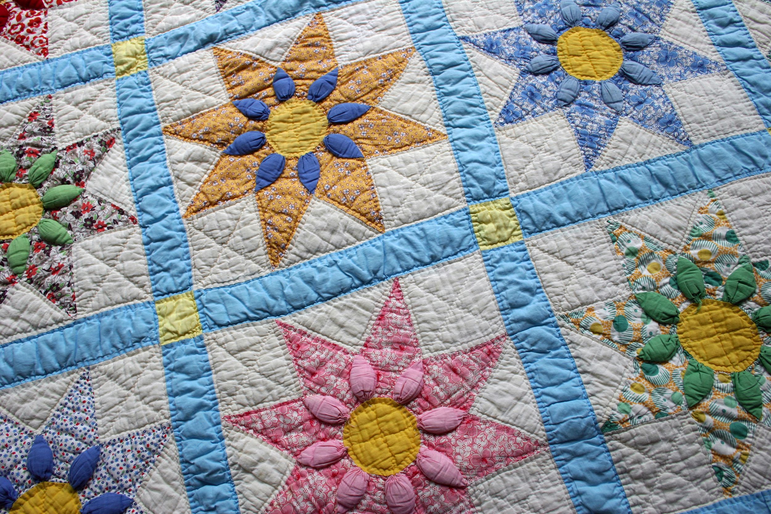 Vintage handmade quilt with flower pattern