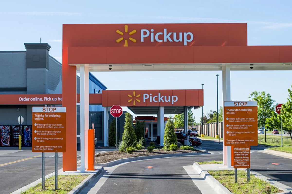 Walmart pickup service area at a local Walmart, with cars parked on the side of the store