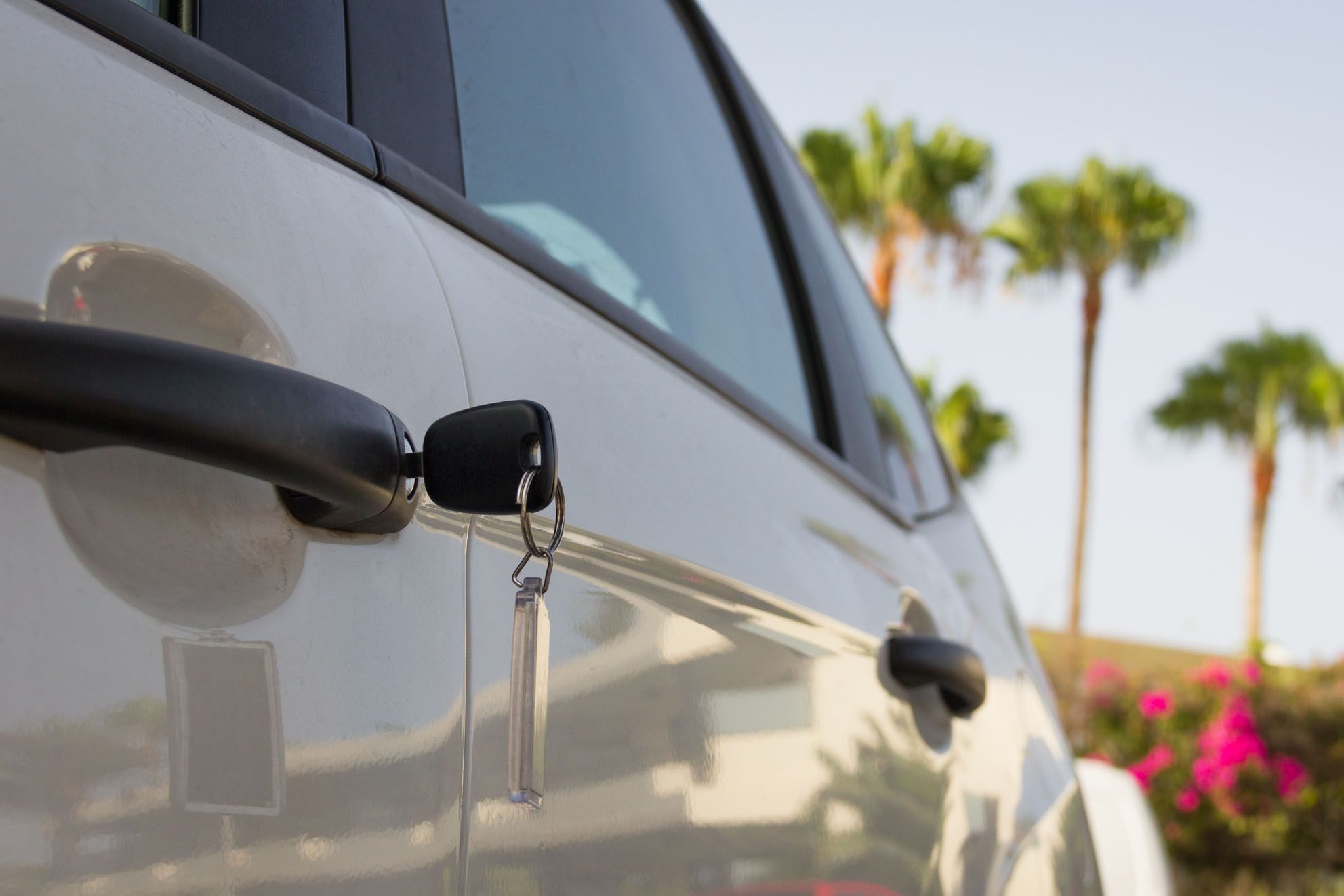 car with keys in door