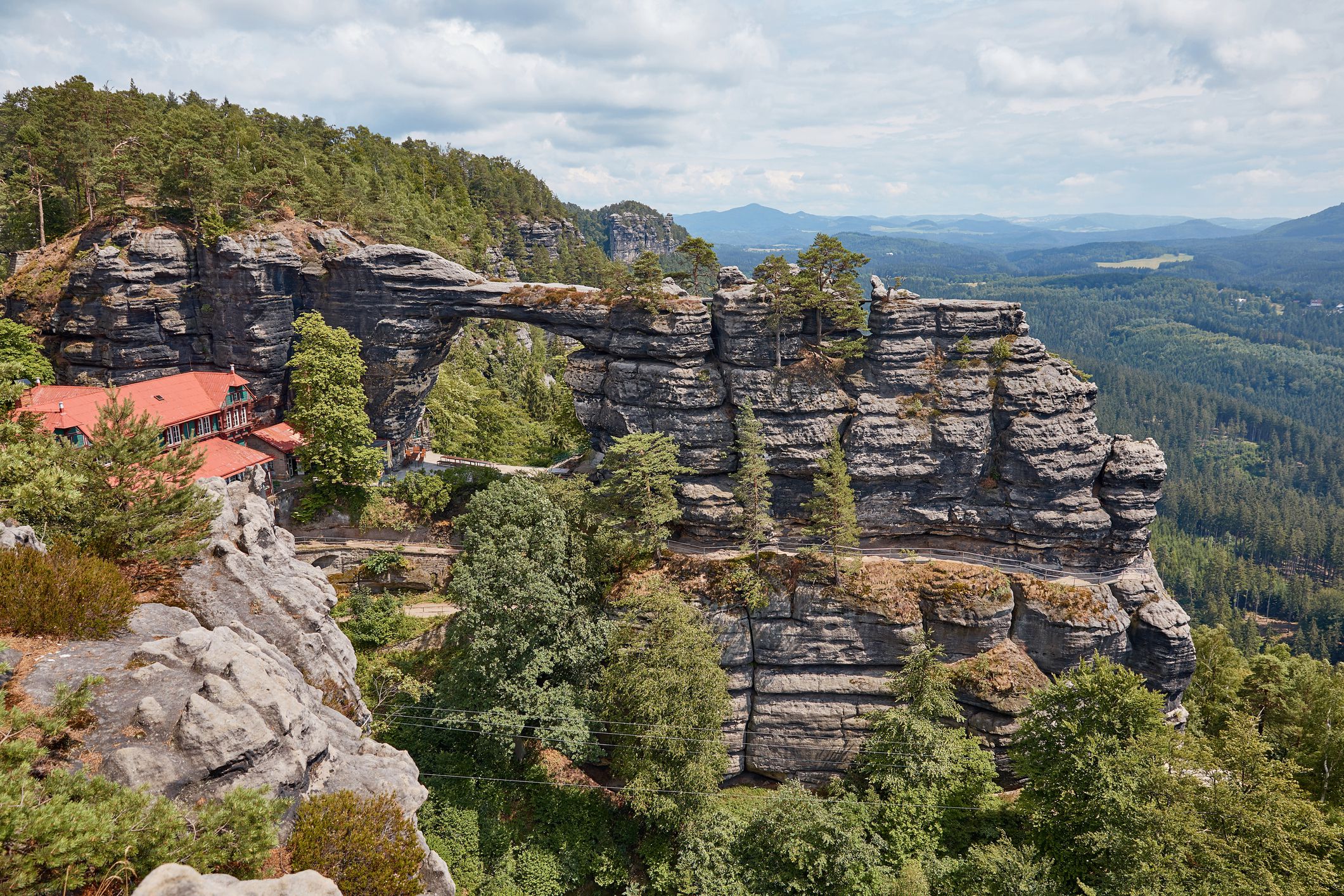 beautiful landscape with pravcicka brana rock formation, Falcons Nest Hotel and forest in Czech Republic