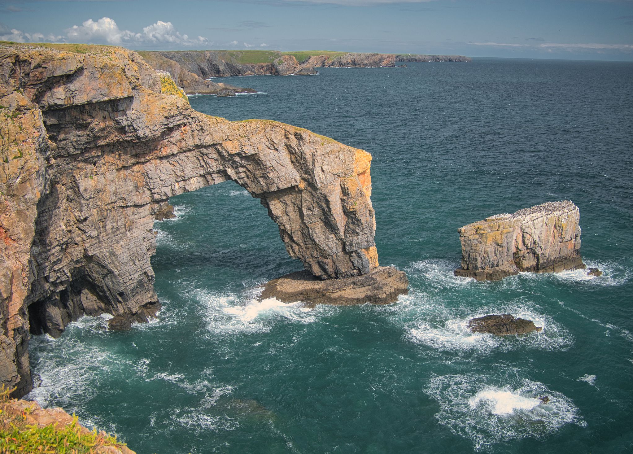 The Green Bridge of Wales / Pont Werdd Cymru near Castlemartin in Pembrokeshire, Wales, UK