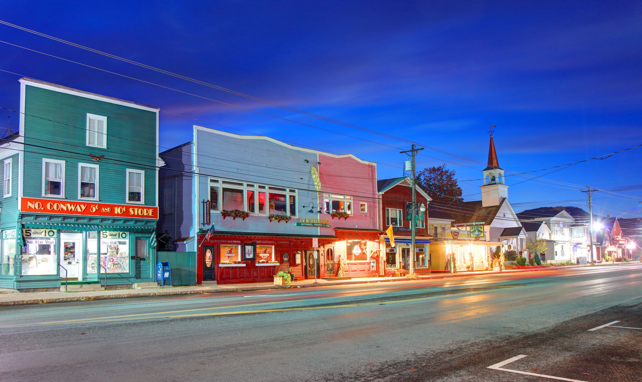 North Conway, New Hampshire, USA - October 3, 2020: Morning view of shops and restaurants along Main Street in the downtown district