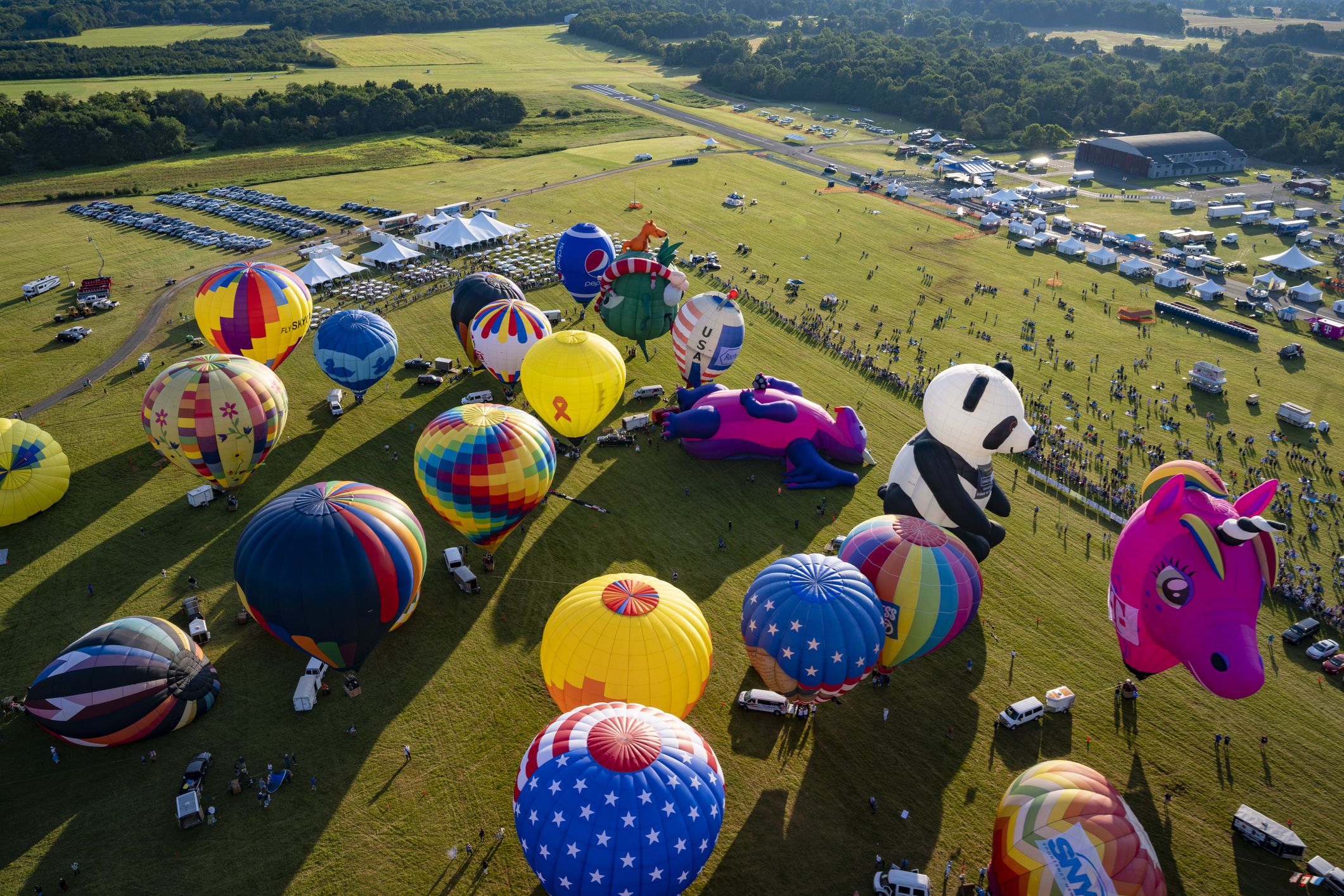 About 100 hot air balloons preparing to leaving Solberg Airport at the New Jersey Balloon Festival in Readington, New Jersey.