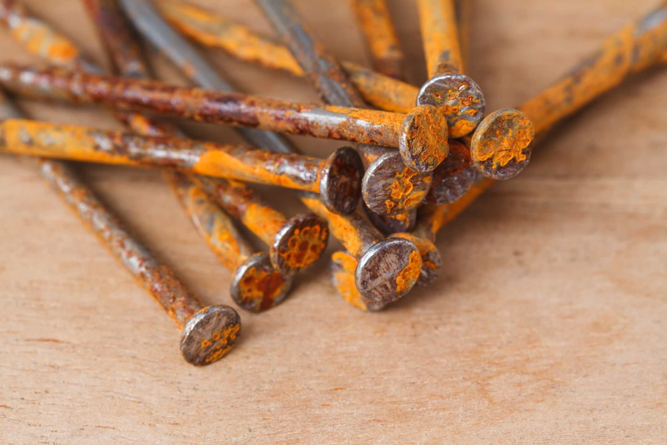 Rusty nail on wooden background