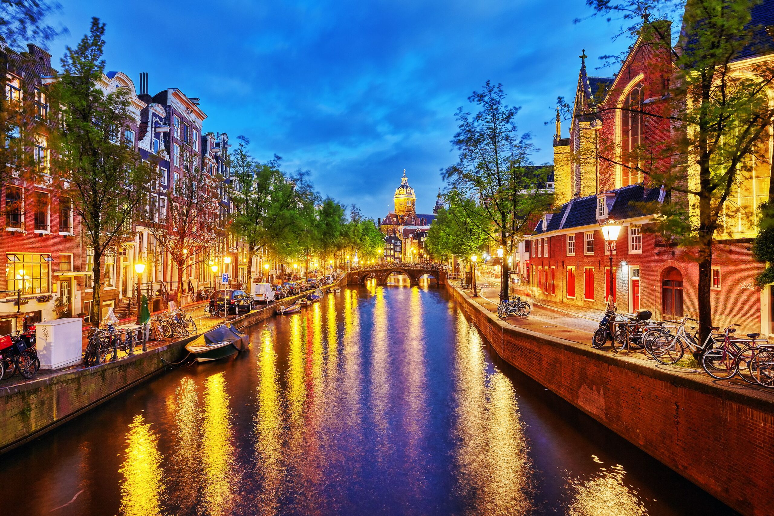 Westerkerk (Western Church), with water canal view in Amsterdam. Netherlands.