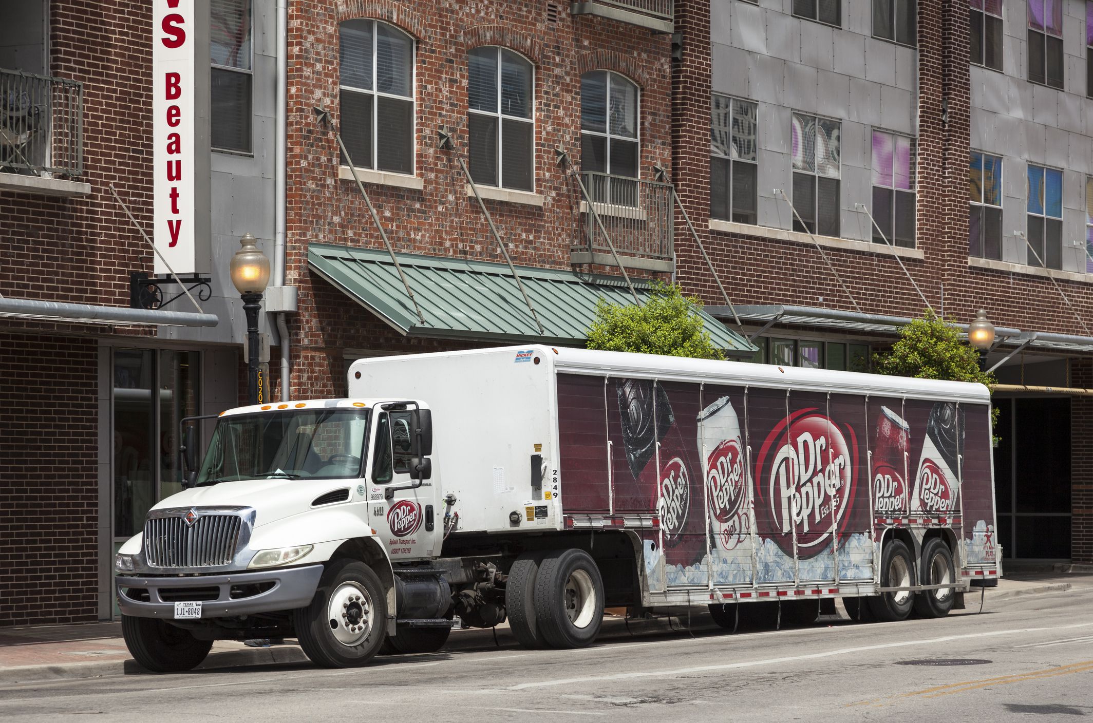 Dallas, Tx, USA - April 7, 2016: Dr Pepper delivery truck in a street of Dallas downtown district. Texas, United States