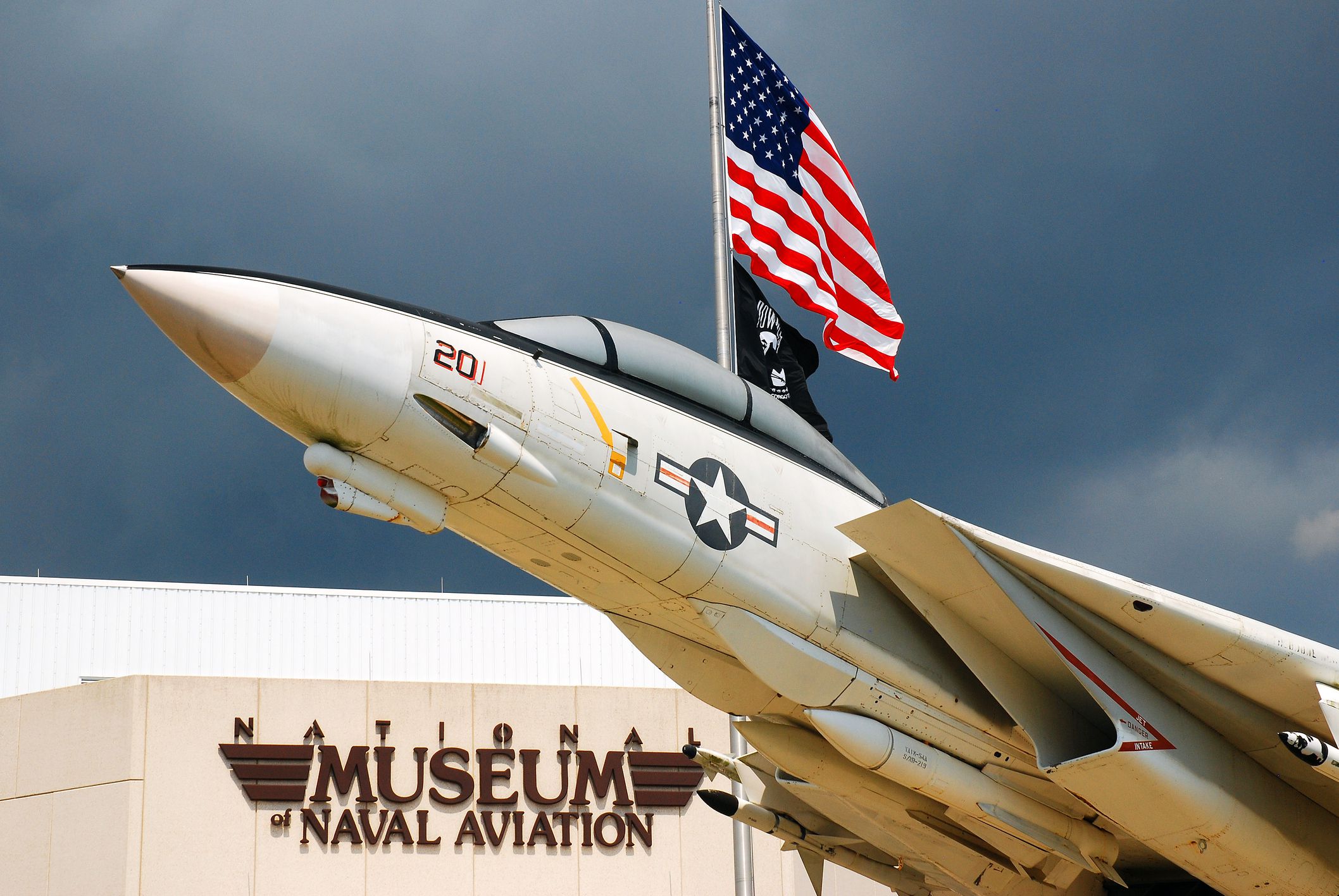 Pensacola, FL, USA September 15, 2011 An F14 appears to soar outside of the National Museum of Naval Aviation in Pensacola, Florida. The museum is dedicated to military aircraft and aviation