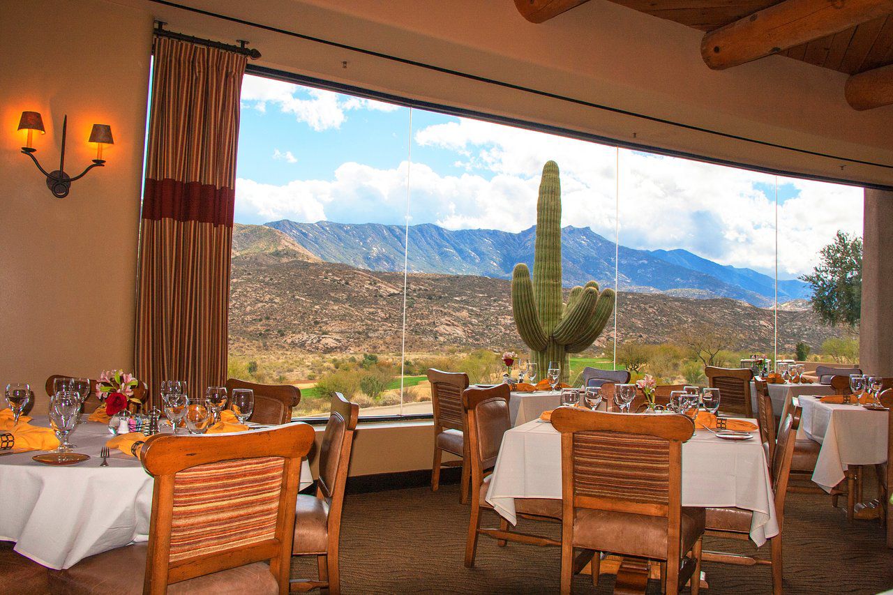 Interior of the Restaurant at The Preserve with huge cactus right outside the window.