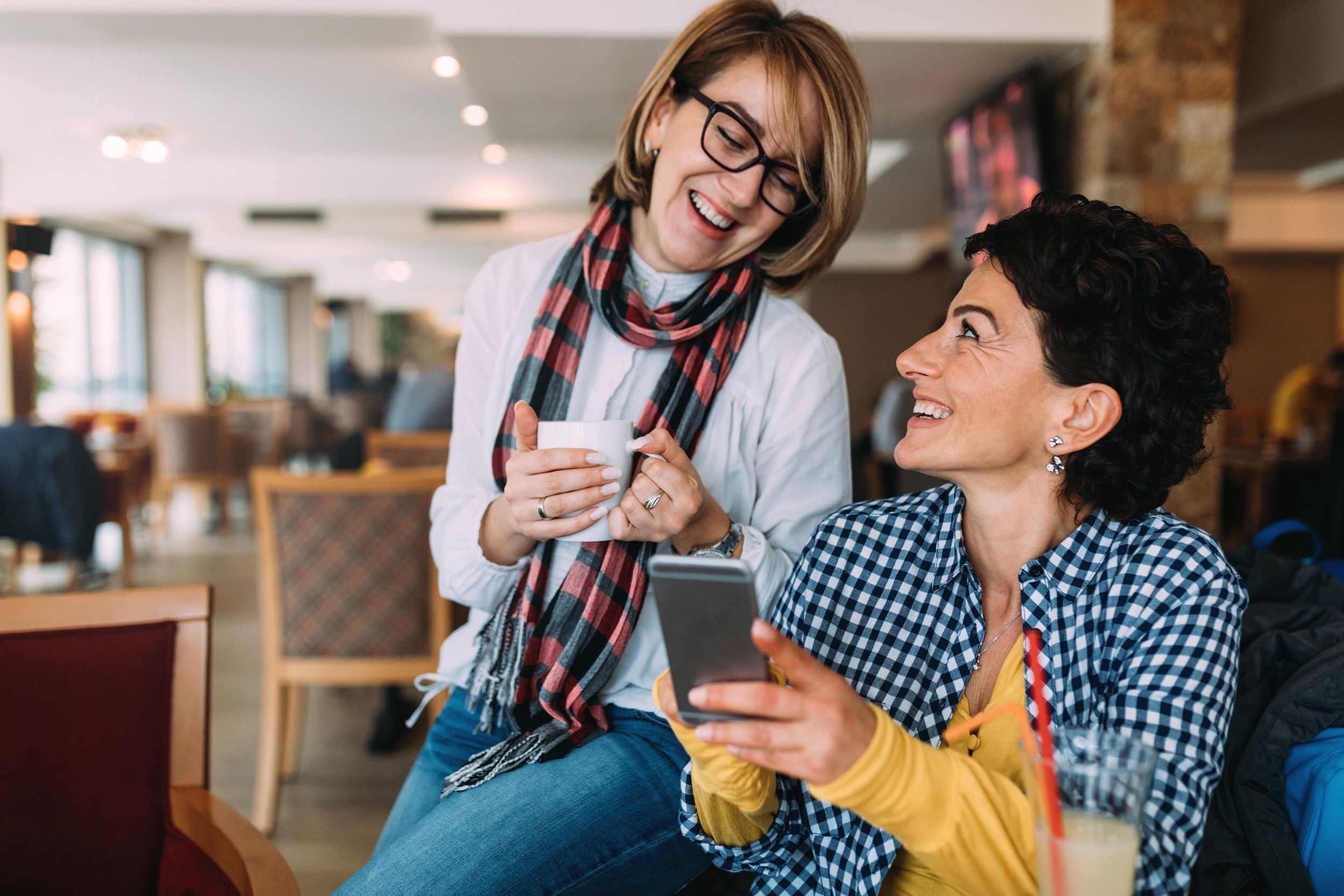 two women talking in coffee shop