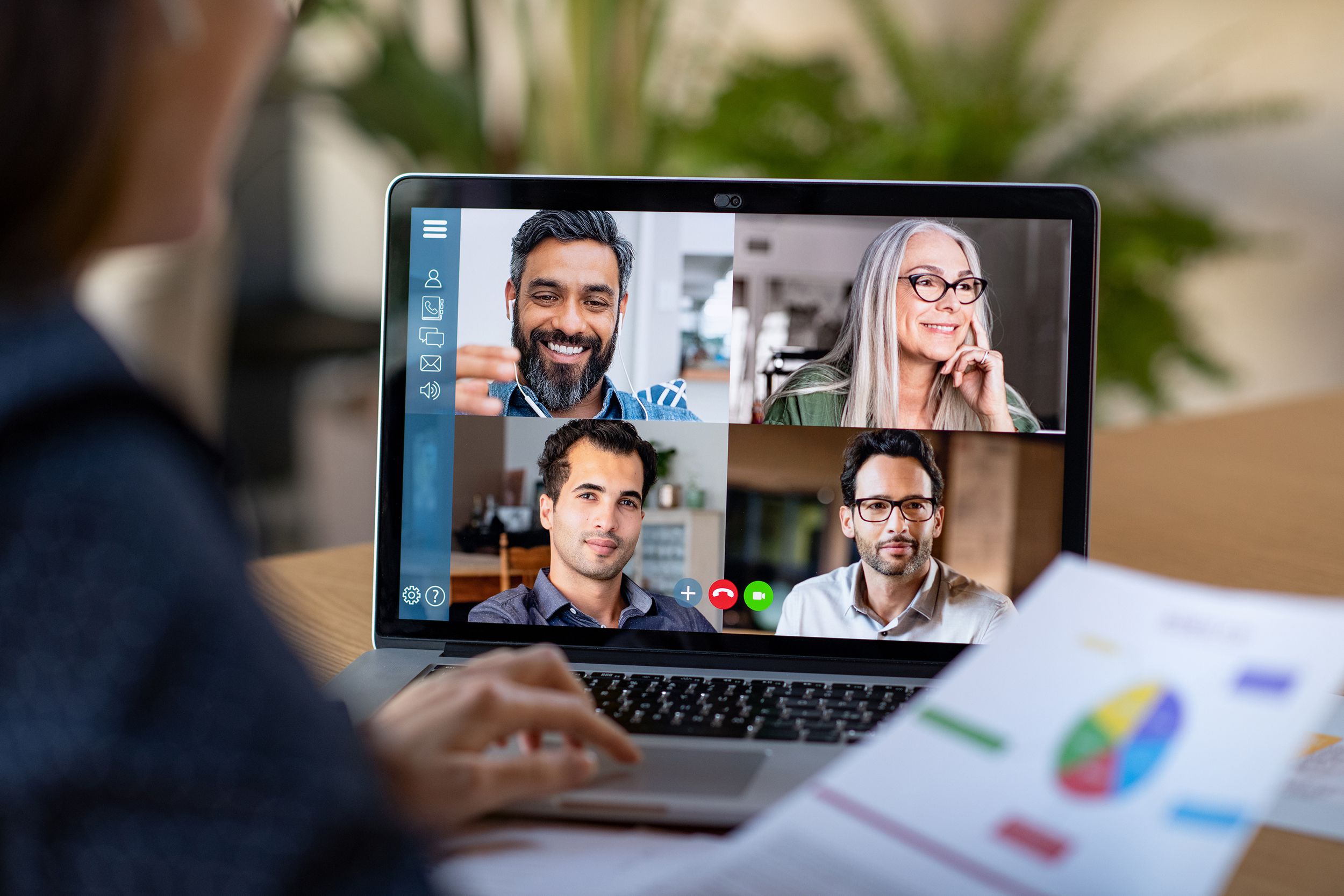 business woman talking to her colleagues about business plan in video conference