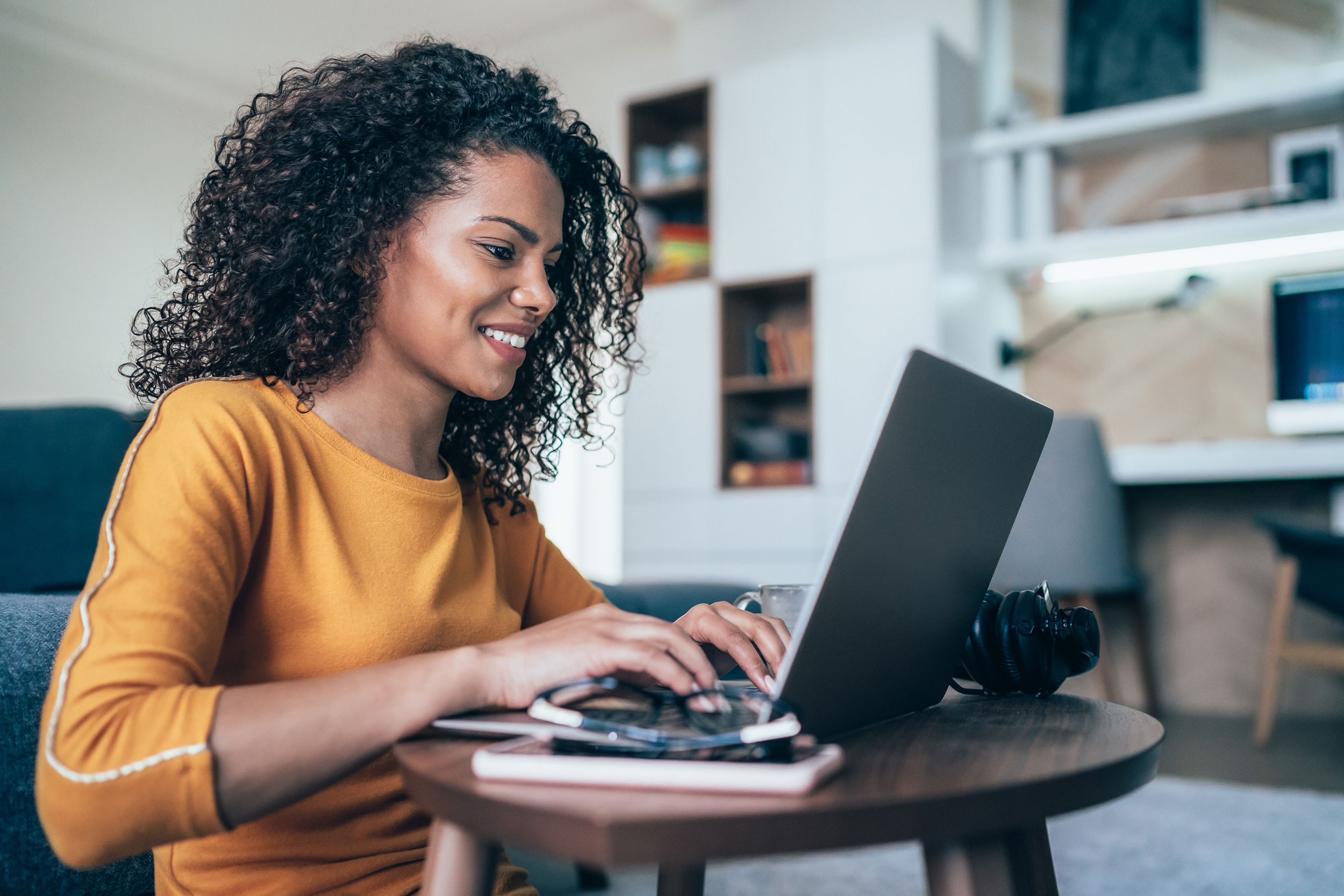 modern woman working from home, using laptop in quarantine