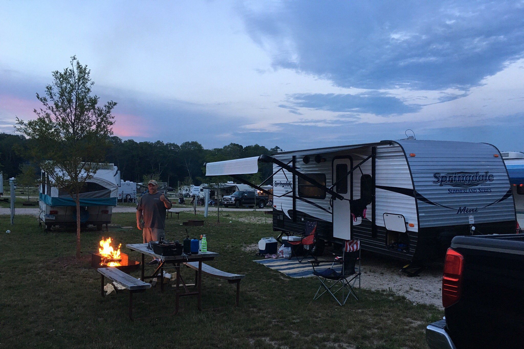 Ashaway RV Resort, Bradford, Rhode Island, sun is setting on RV park area