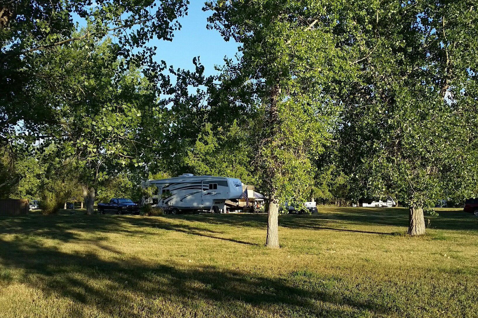 Cherry Creek State Park Campground, Aurora, Colorado, RV park area in background with grassy area in foreground