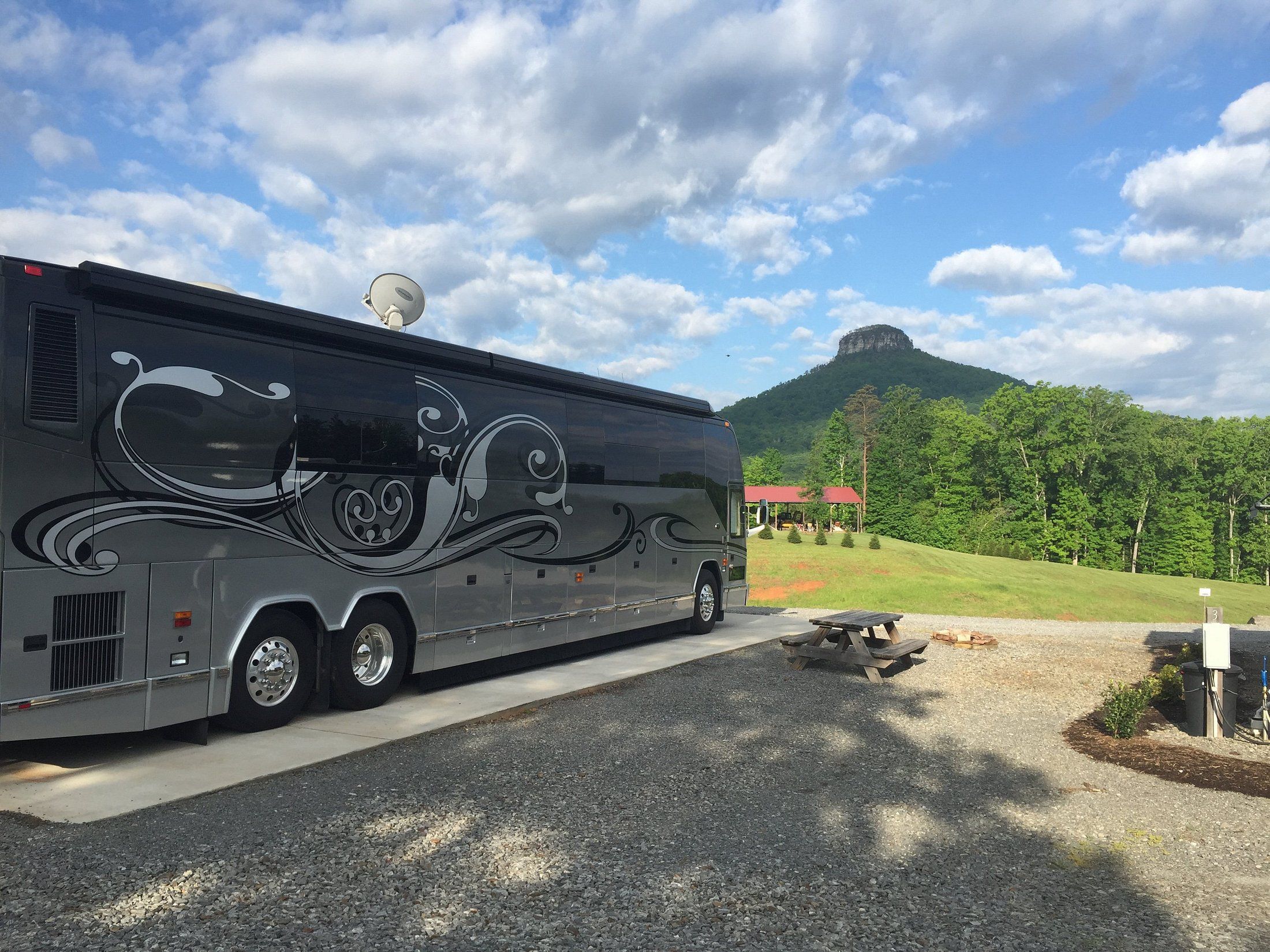 Greystone RV Park, Pinnacle, North Carolina, RV in a lot with a mountain in the background