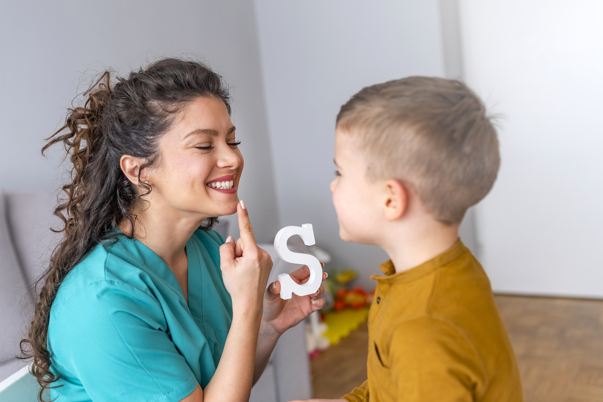 Woman assisting child