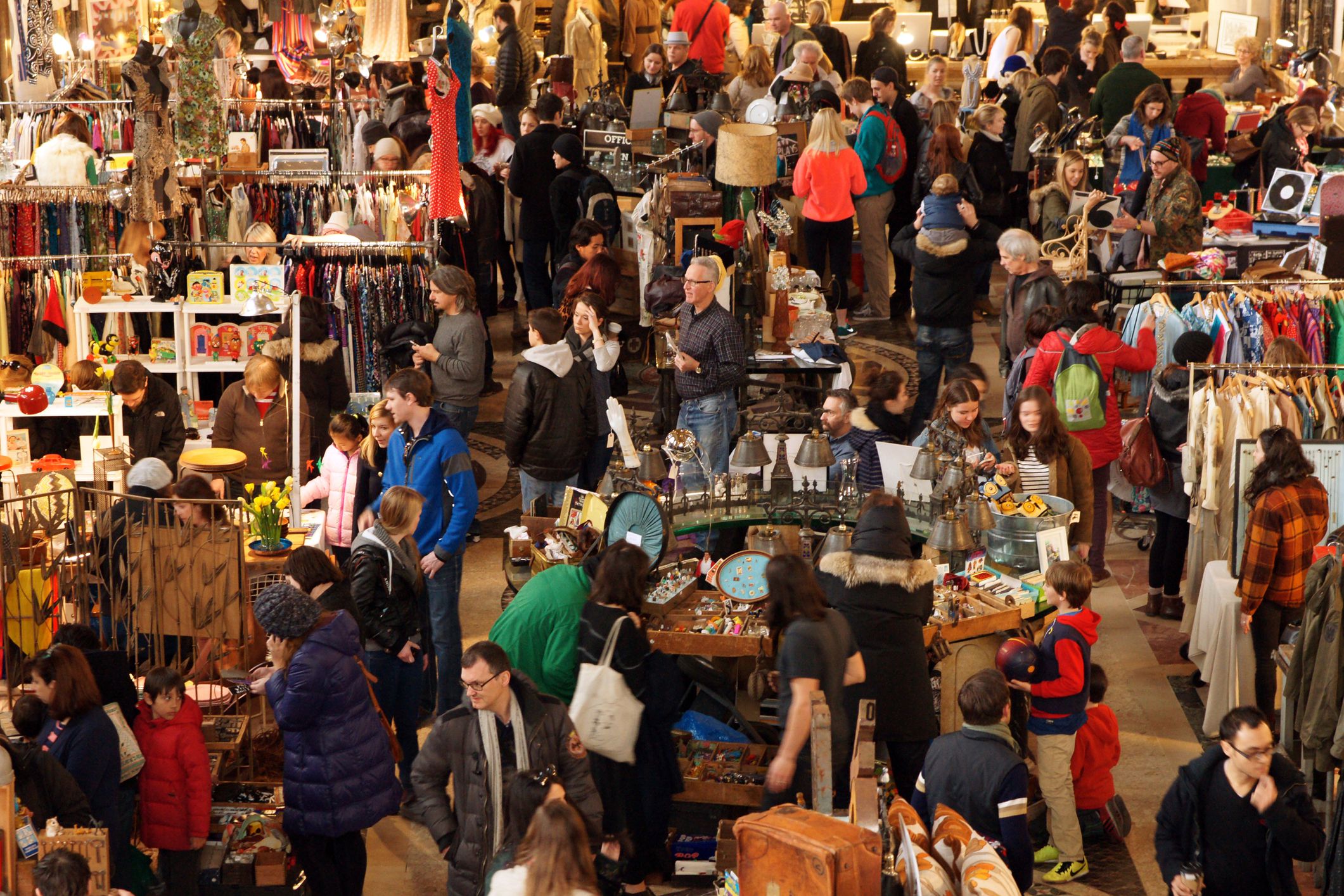 Many people shopping at the Brooklyn Flea Market inside the main hall of Williamsburgh Savings Bank Building at 1 Hanson Place, Brooklyn