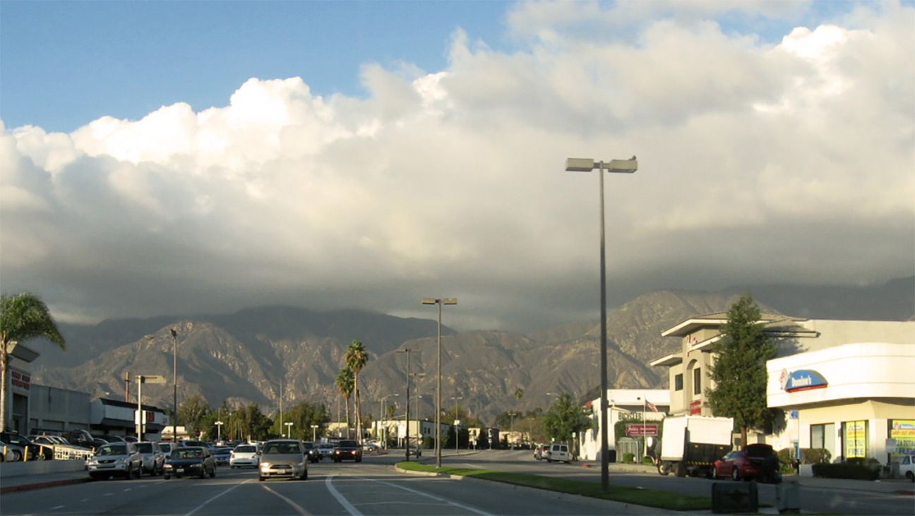 Sun breaking through low clouds in Pasadena, California